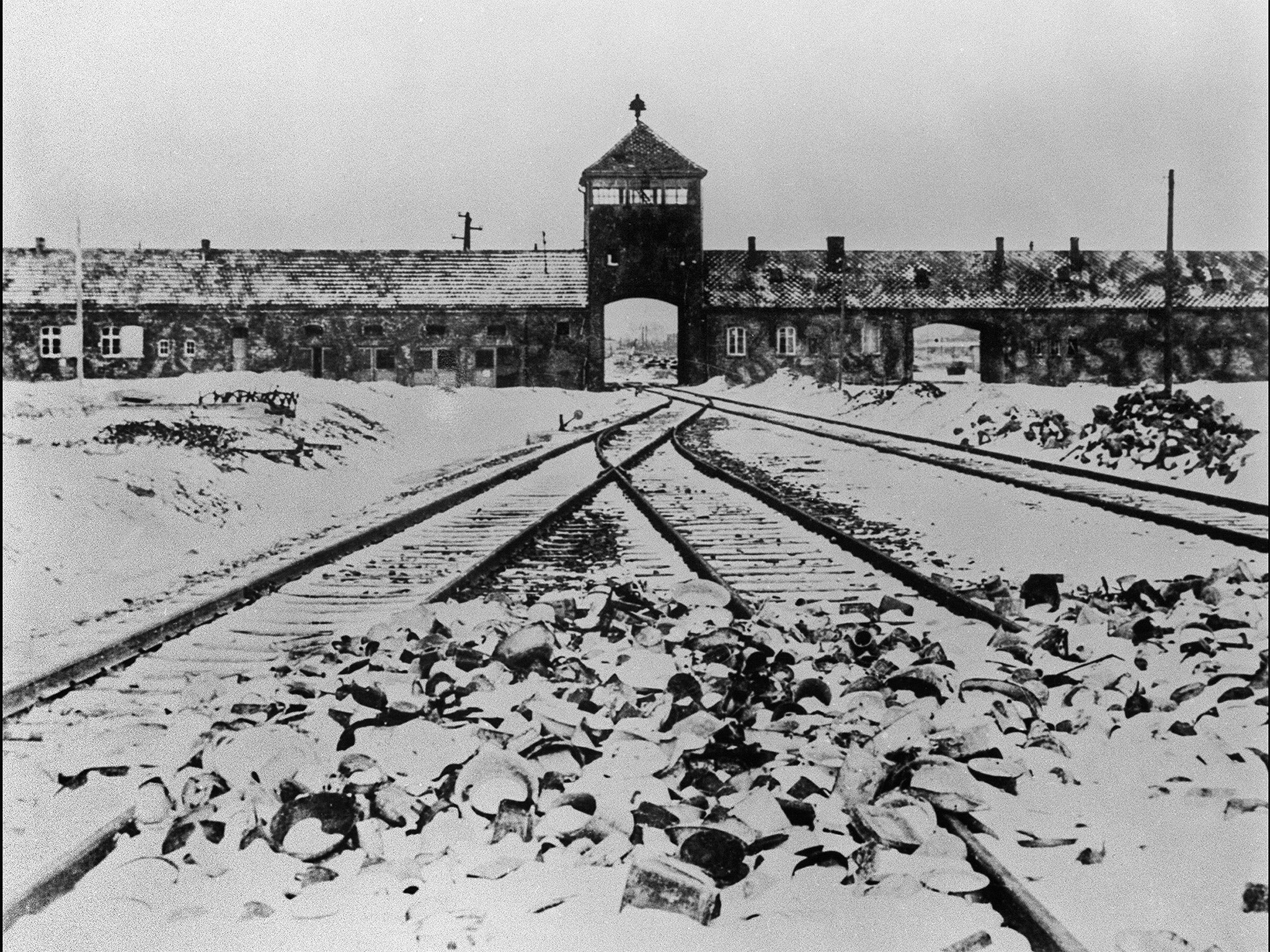 The Auschwitz concentration camp gate and railways (Getty)