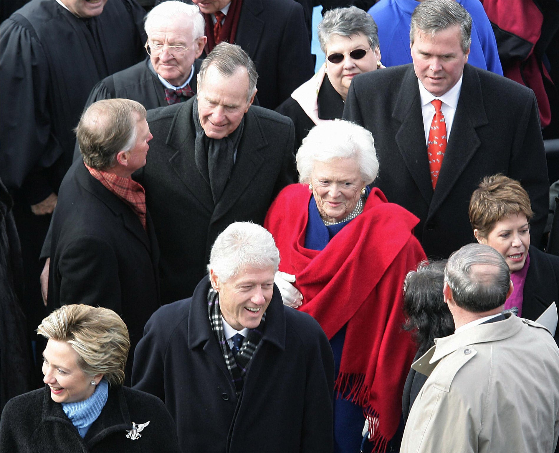 Friends and foes: relations between the Clintons (foreground) and the Bushes have alternated between bitter and mutually beneficial