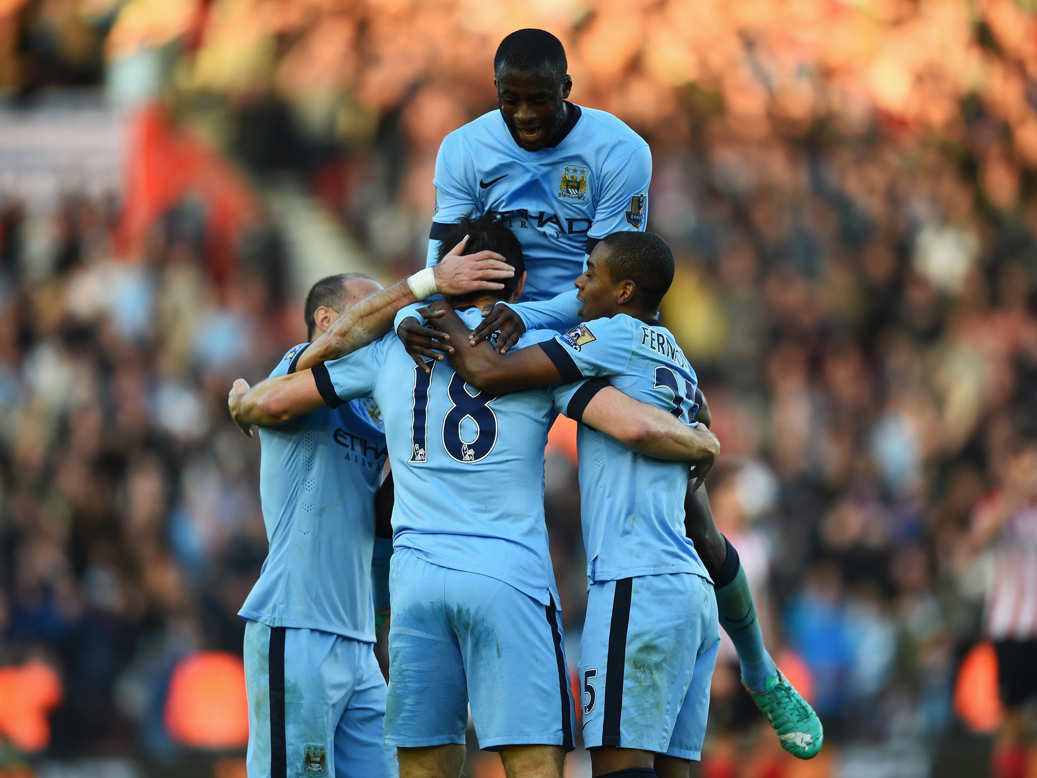 Yaya Toure celebrates a goal with his Manchester City team-mates