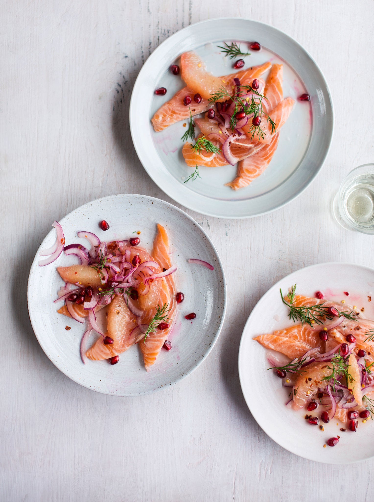 Salmon crudo with grapefruit, pomegranate, dill and red-onion salad