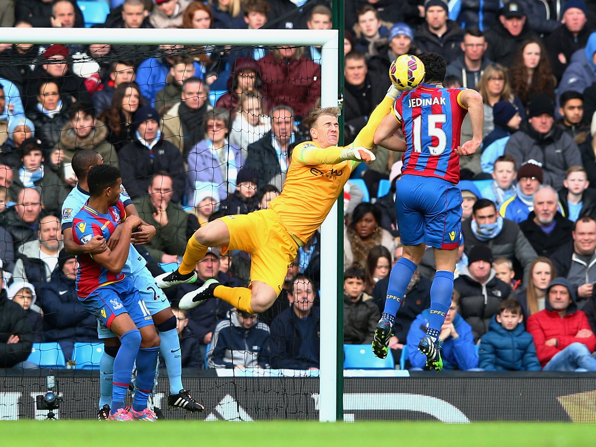 Joe Hart saves a header from Mile Jedinak