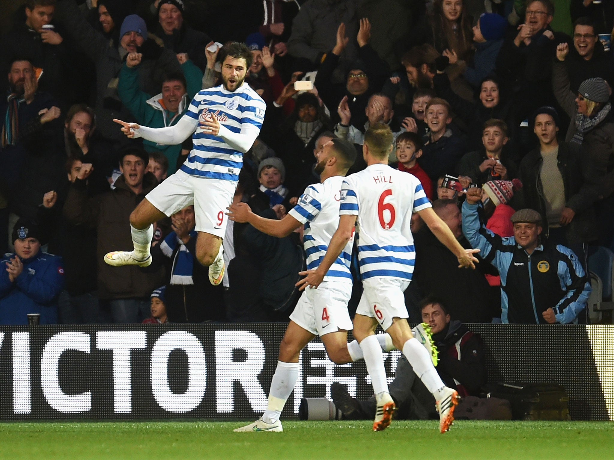 Charlie Austin celebrates scoring his second for QPR