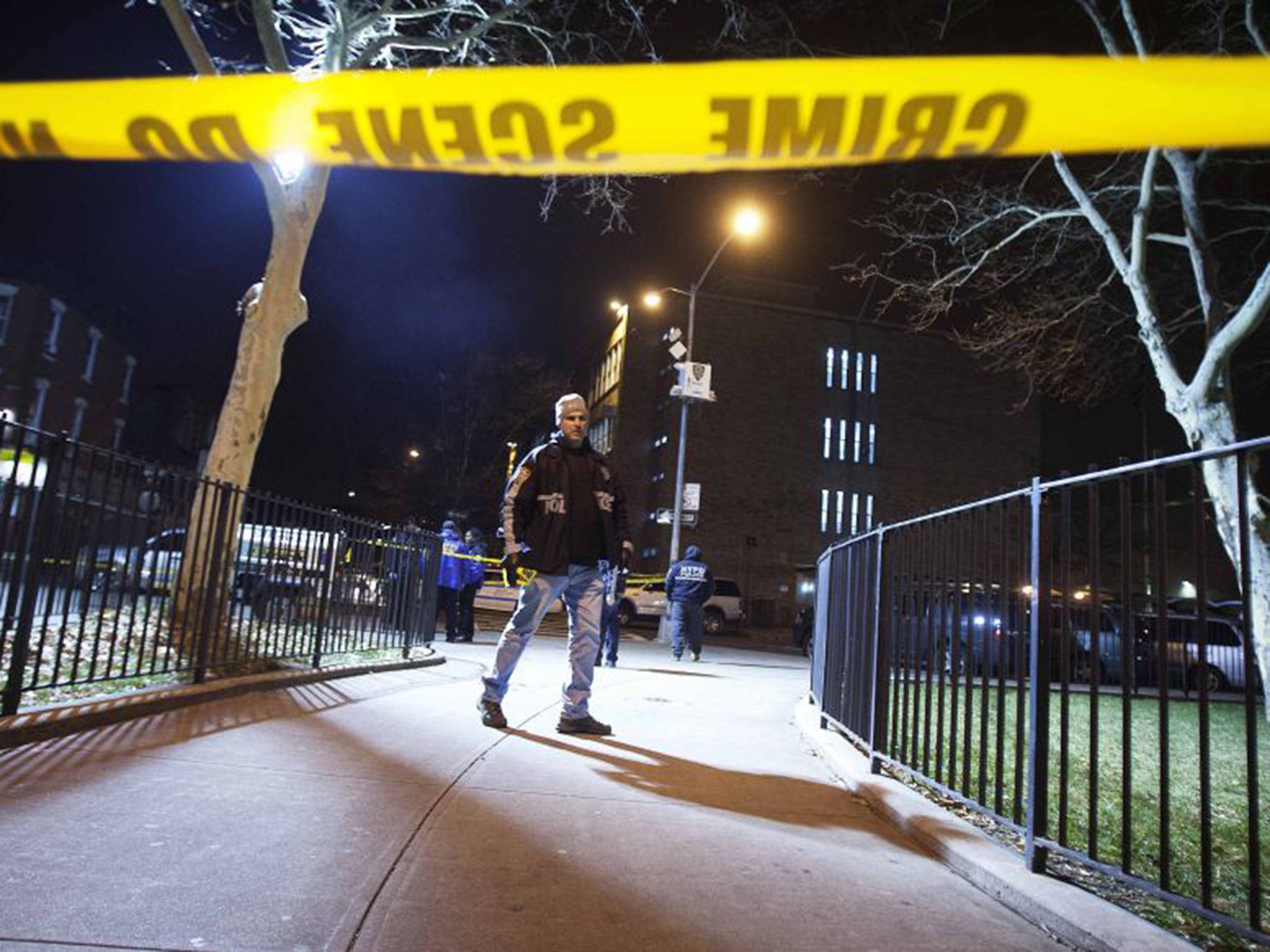 Police at the scene of the fatal shootings in Brooklyn