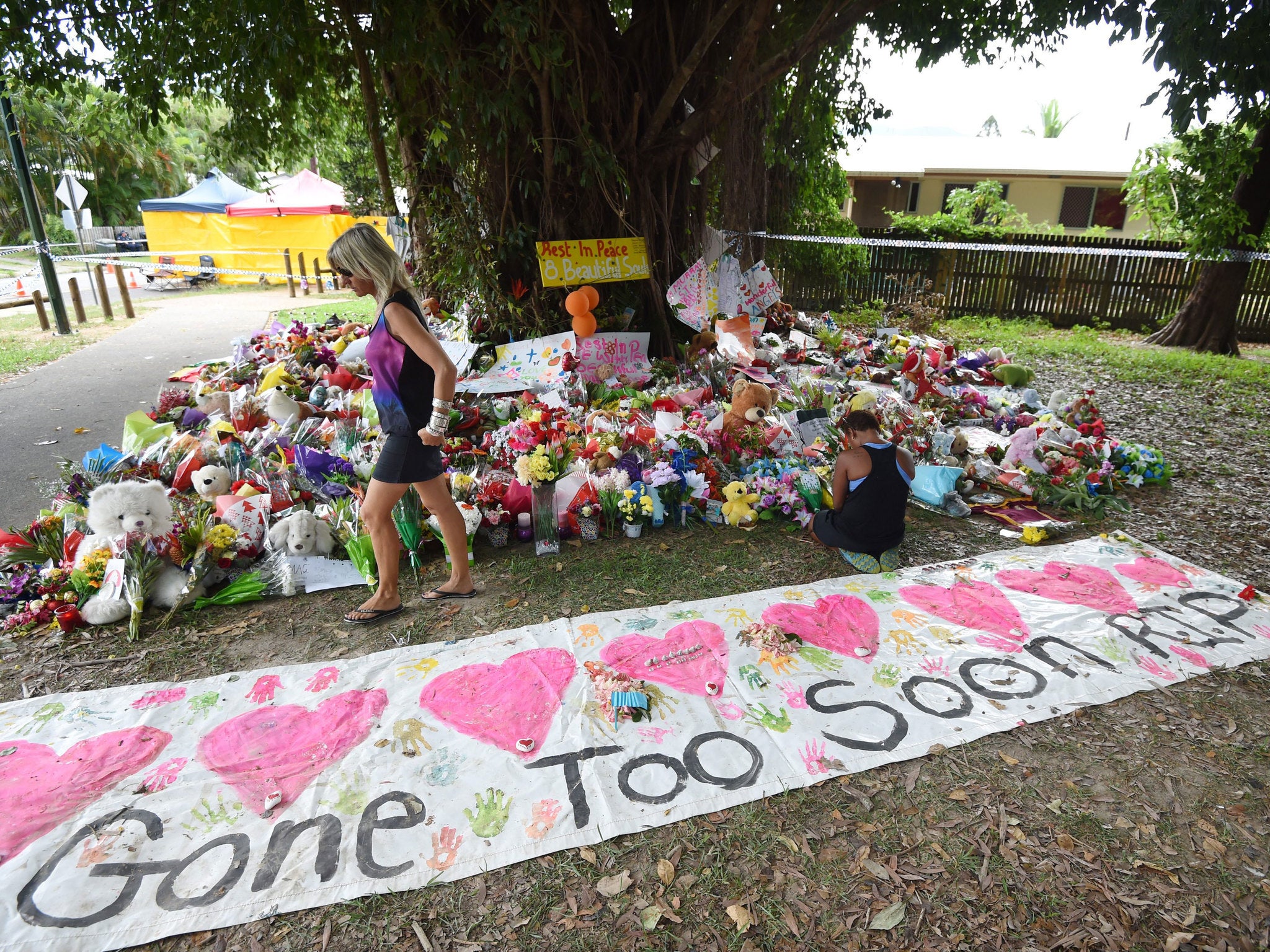 An Australian mother who was found with stab wounds alongside the bodies of her seven dead children and her niece has been charged with murder