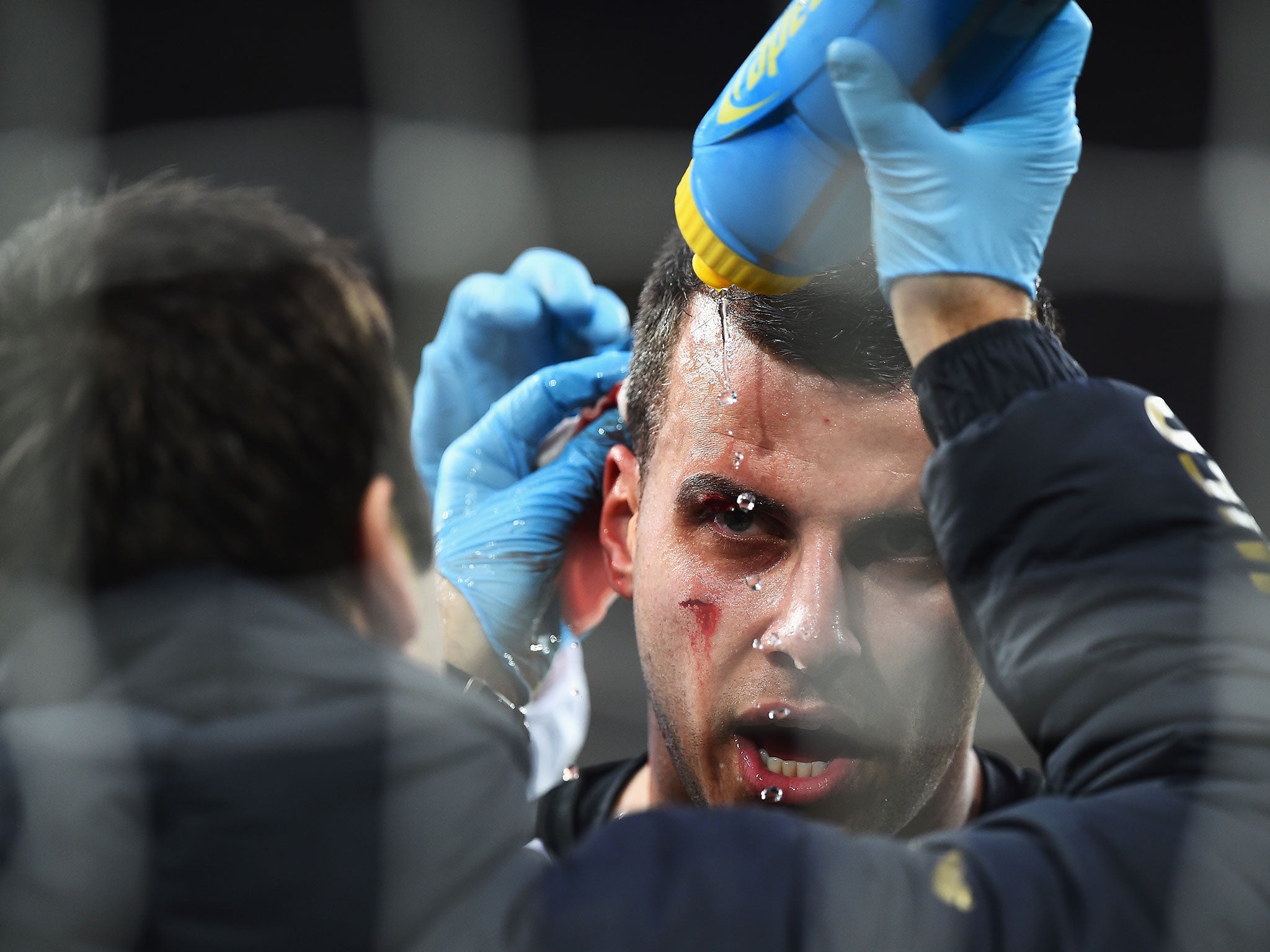 Steven Taylor receives treatment after connecting with the post