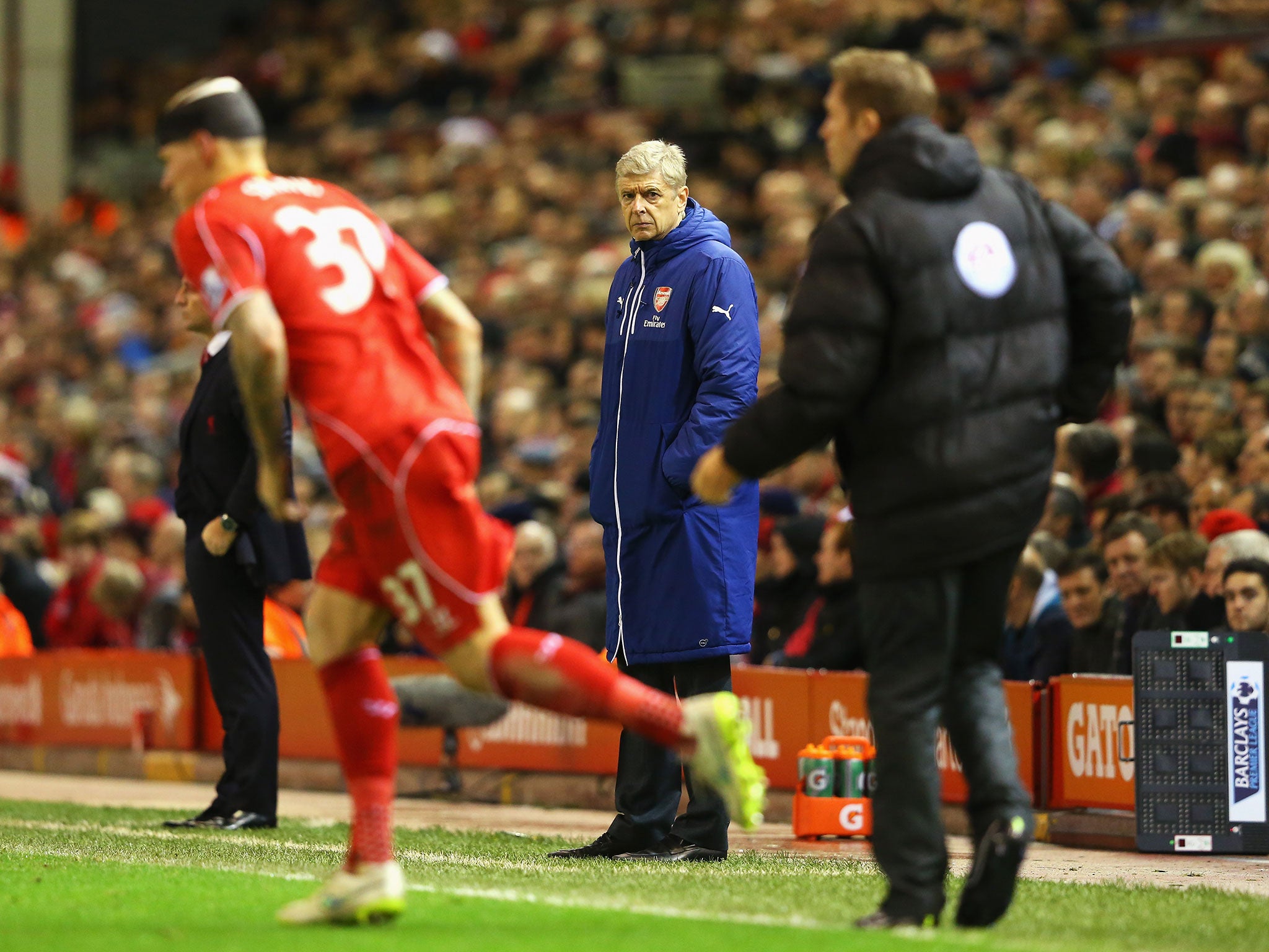 Martin Skrtel, complete with bandage, re-enters the pitch