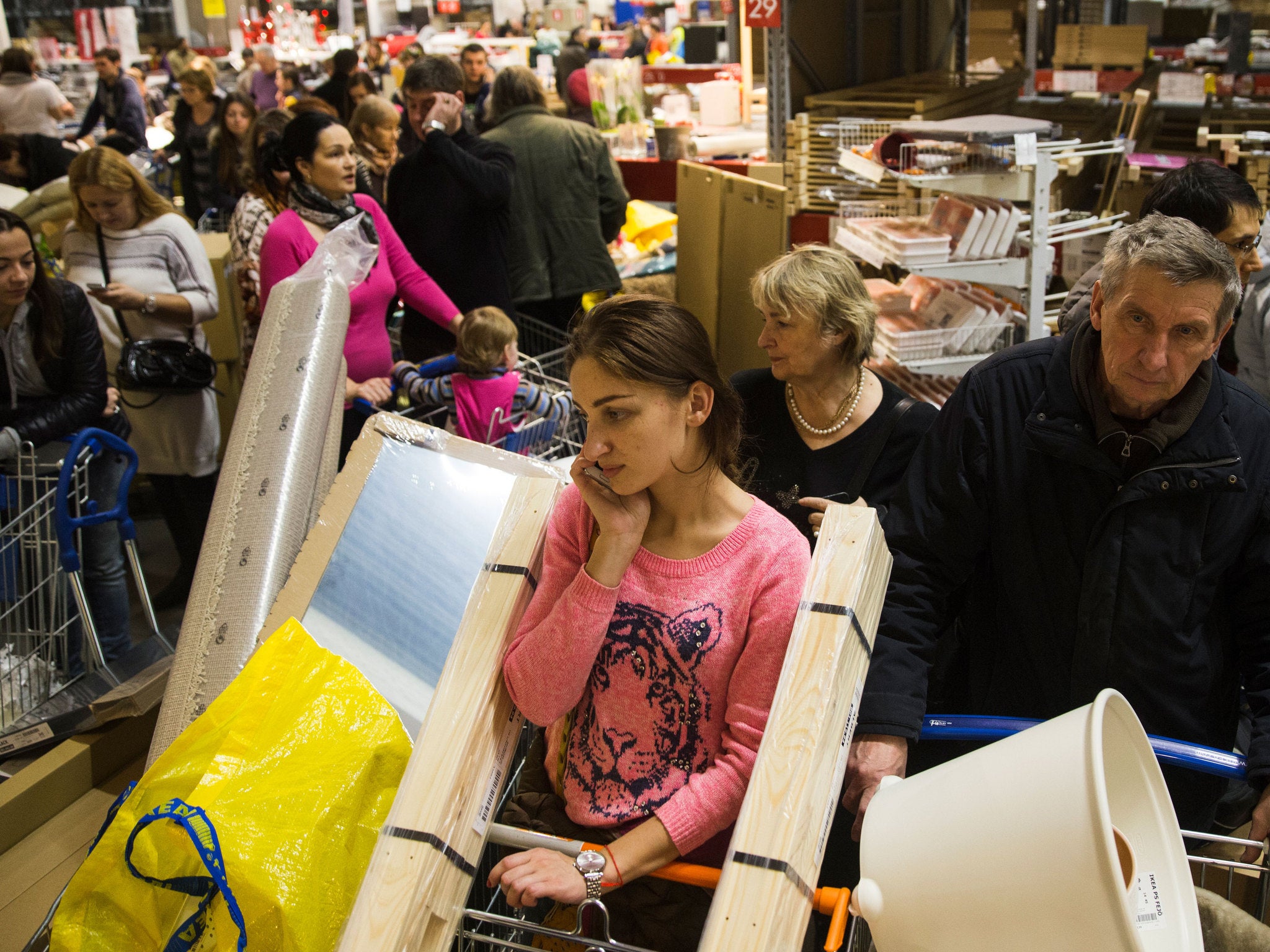 Russians in a crowded IKEA store before prices were hiked