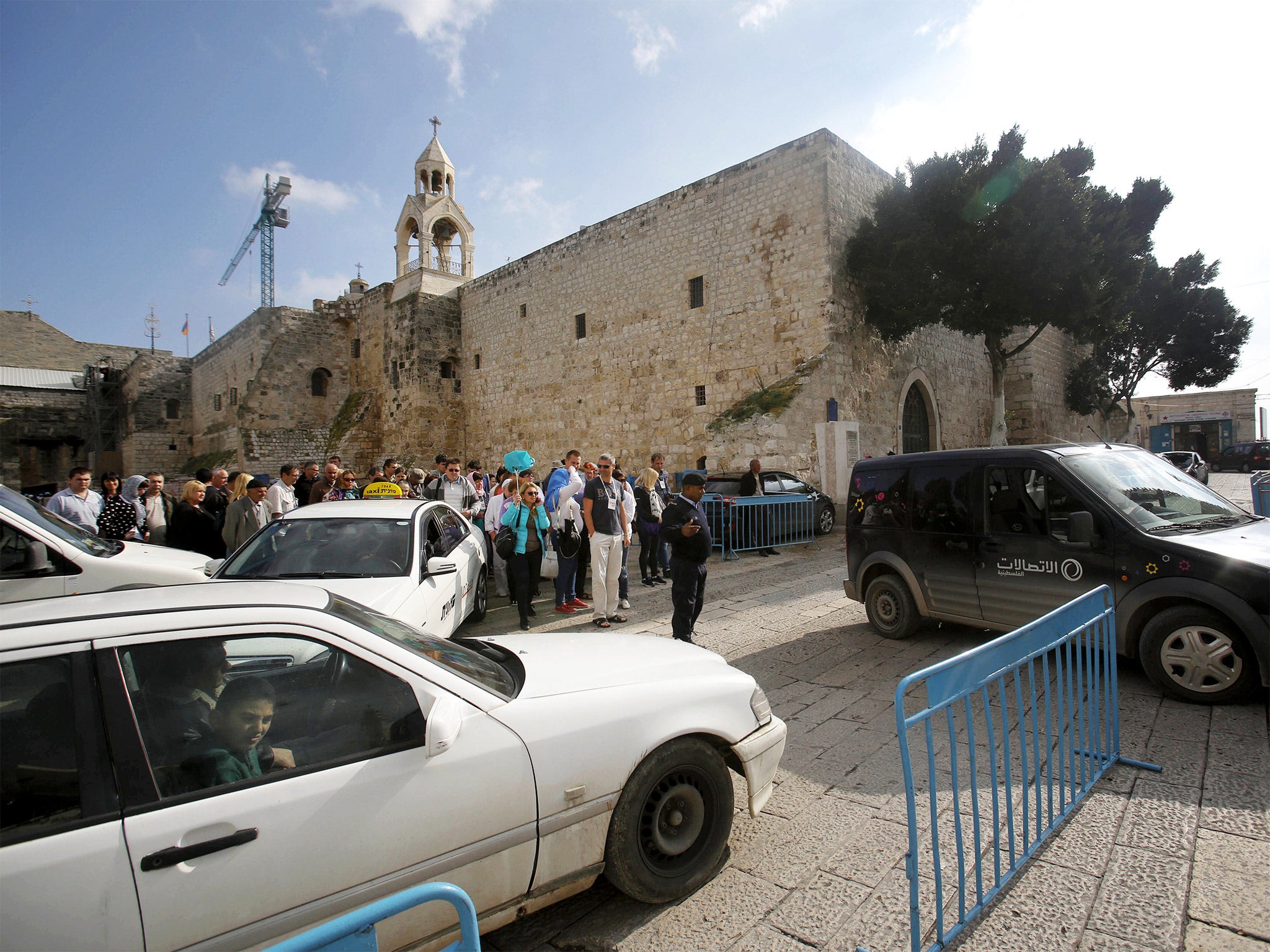 The Church of the Nativity in Manger Square, Bethlehem, where tourists and cars compete for space