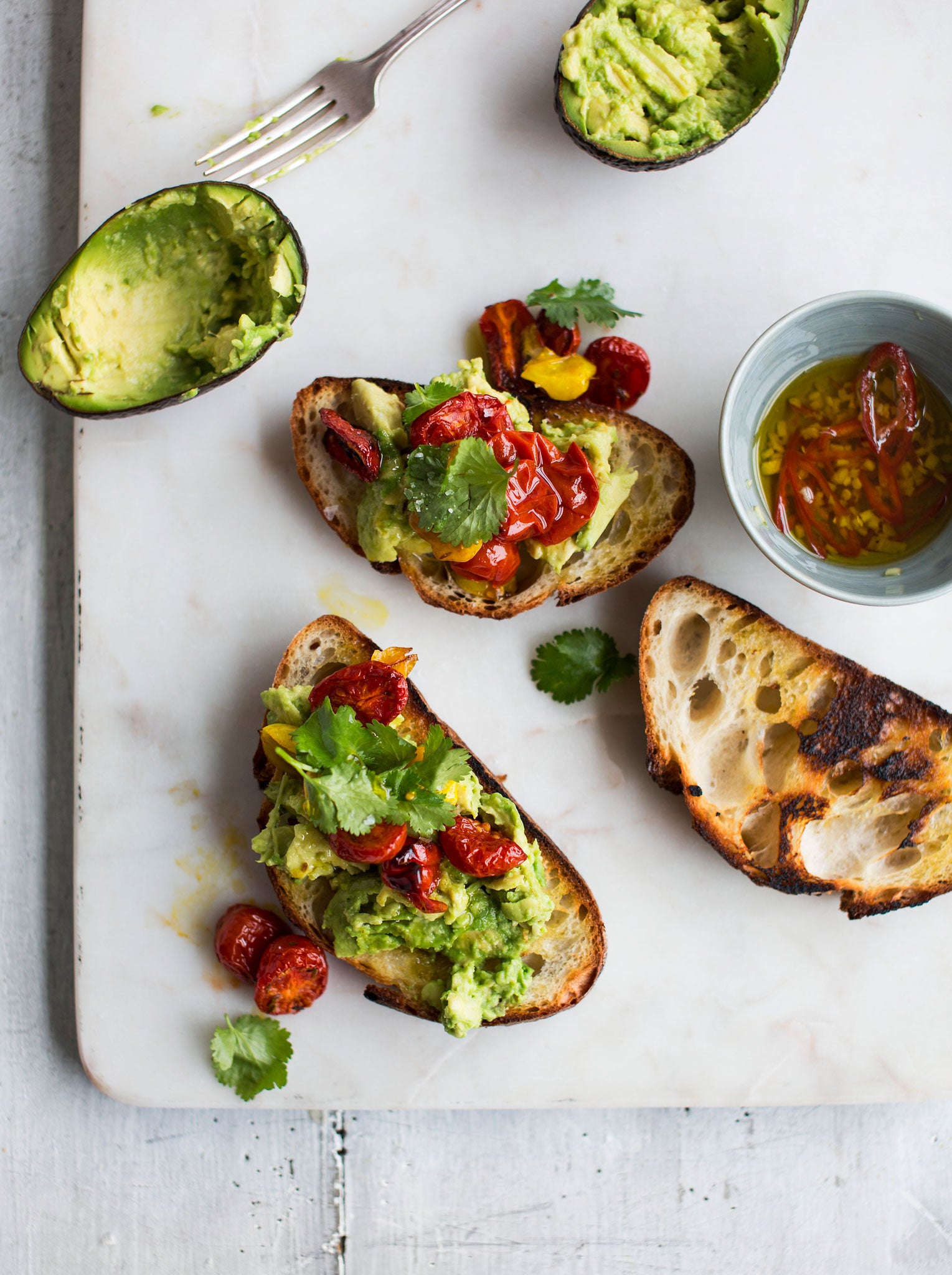 Avocado and spiced roasted tomatoes on sourdough