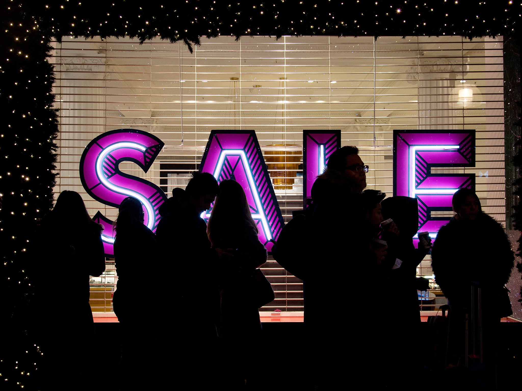 People queue and wait for the shops to open on Boxing Day