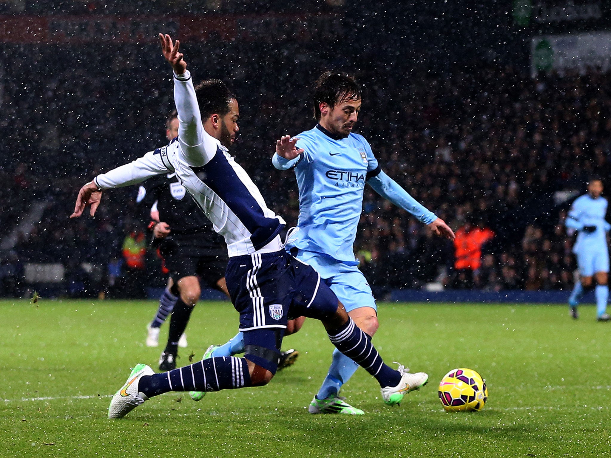 Joleon Lescott brings down David Silva to give away a first-half penalty