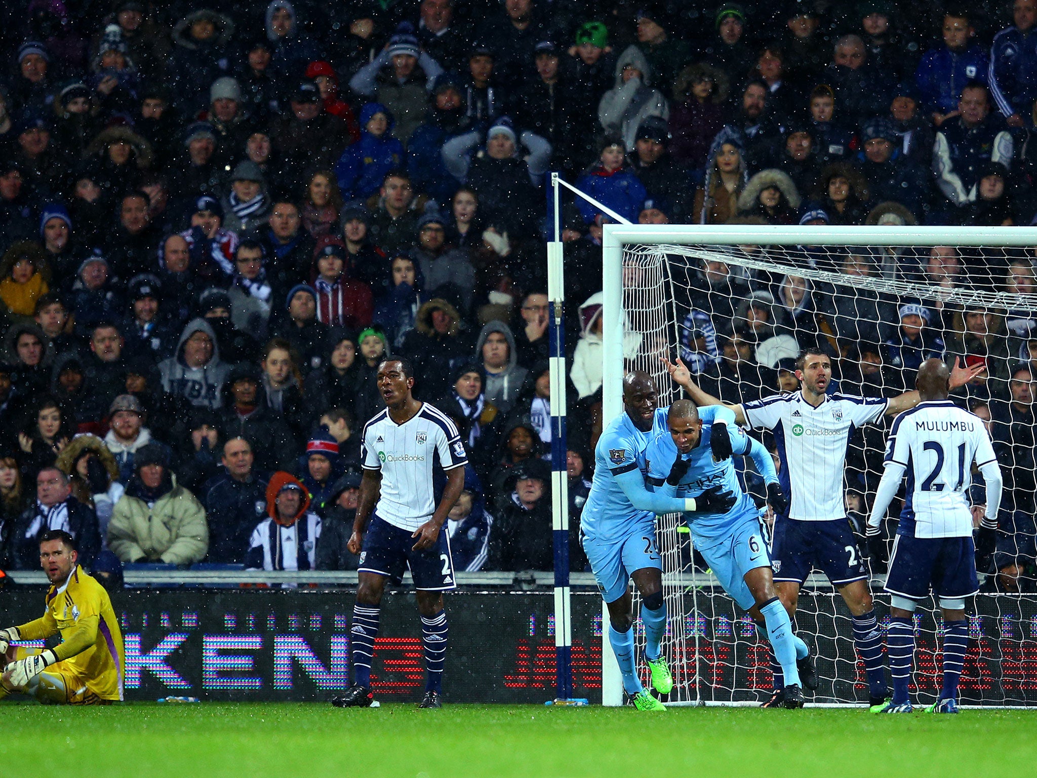 Yaya Toure celebrates with Fernando after the latter puts City ahead