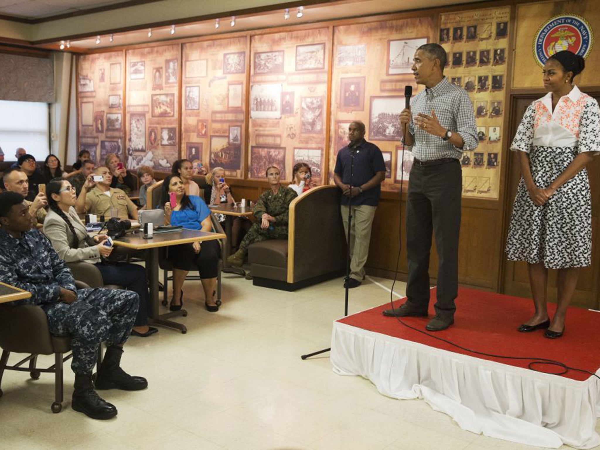 President Obama, with first lady Michelle, claimed the Afghan war made the world 'safer' in Kaneohe Bay, Hawaii, on Christmas Day