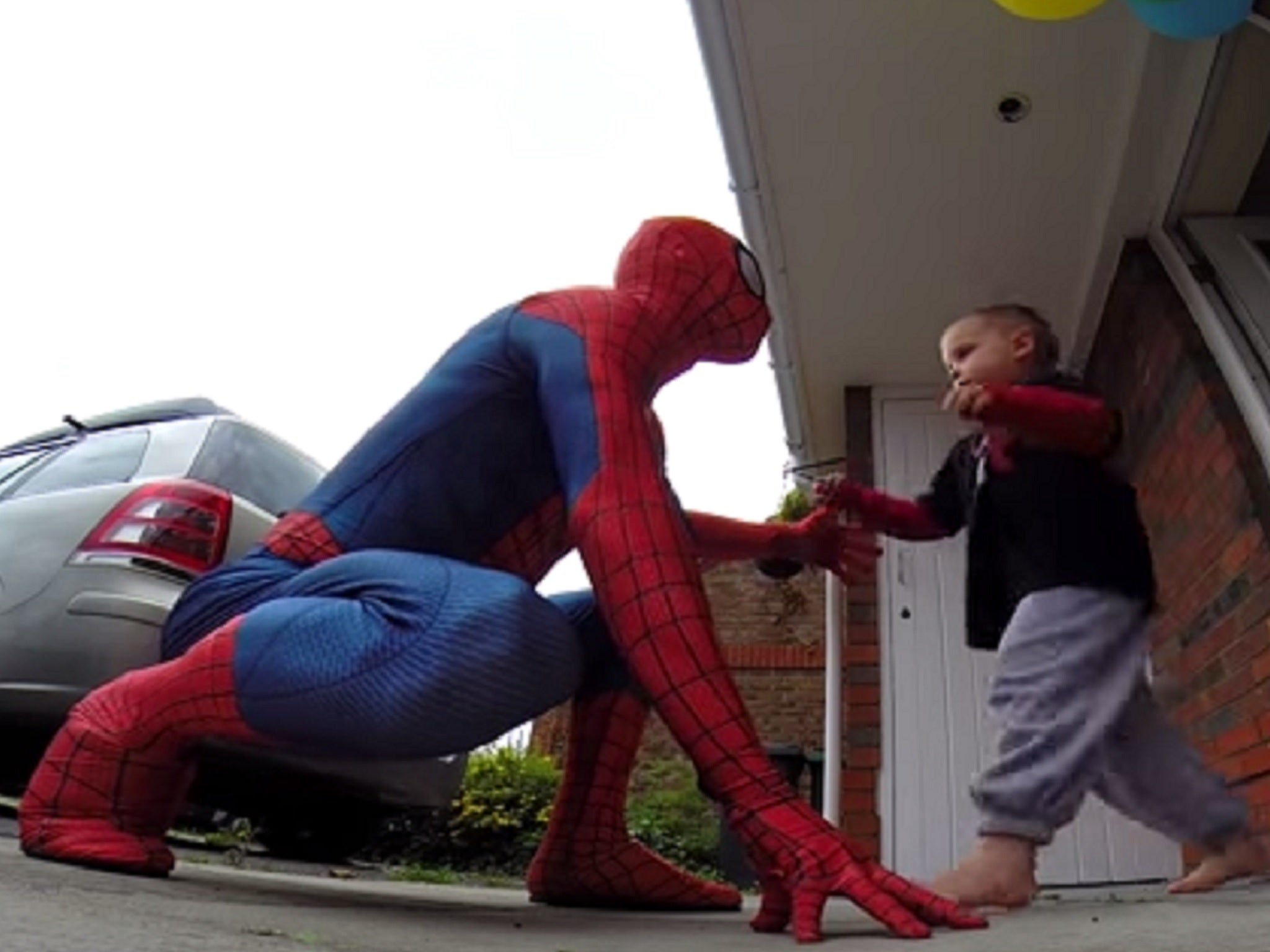 Jayden being surprised by Spider-Man on his birthday