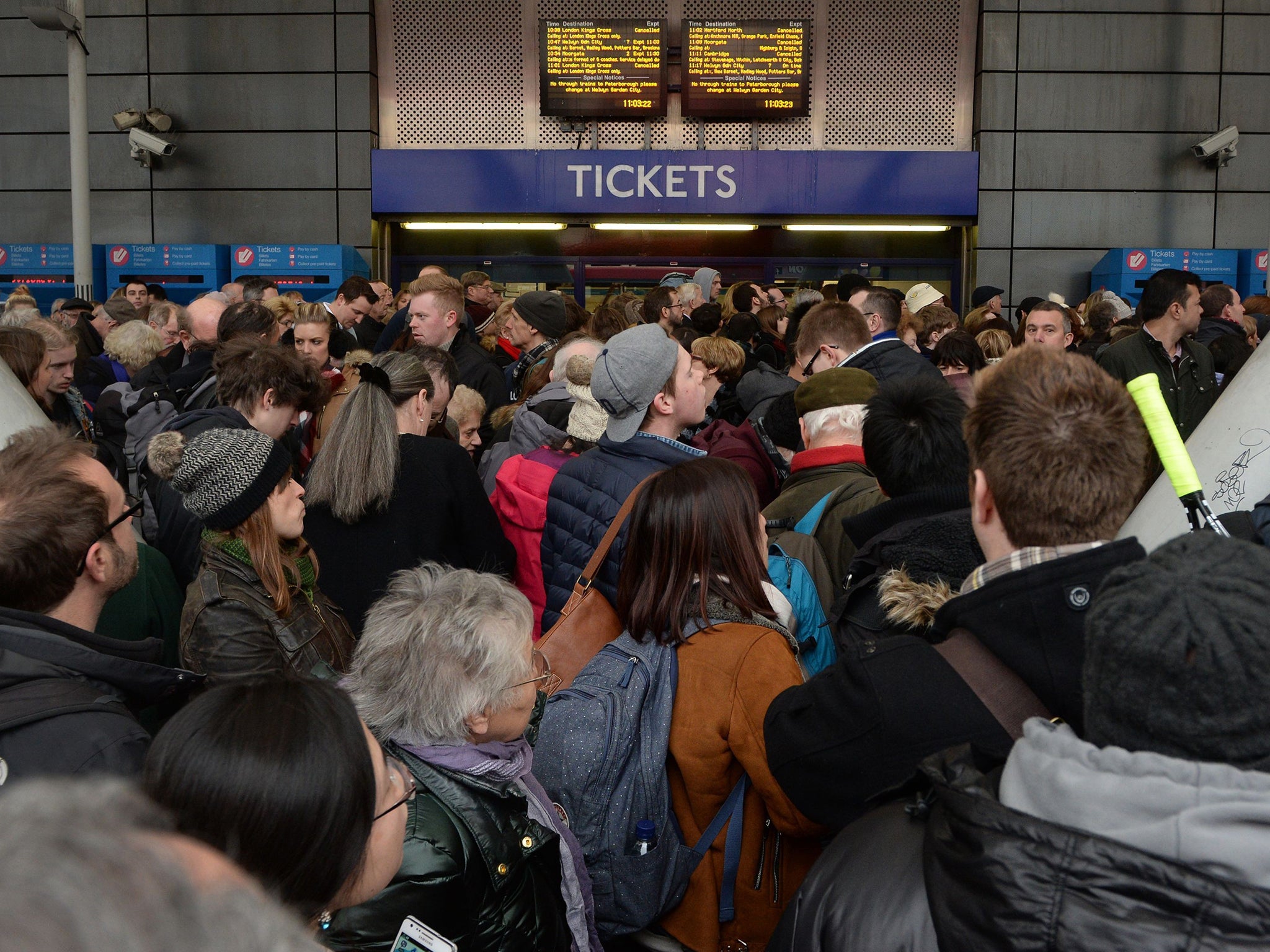 People wait outside Finsbury Park station, London