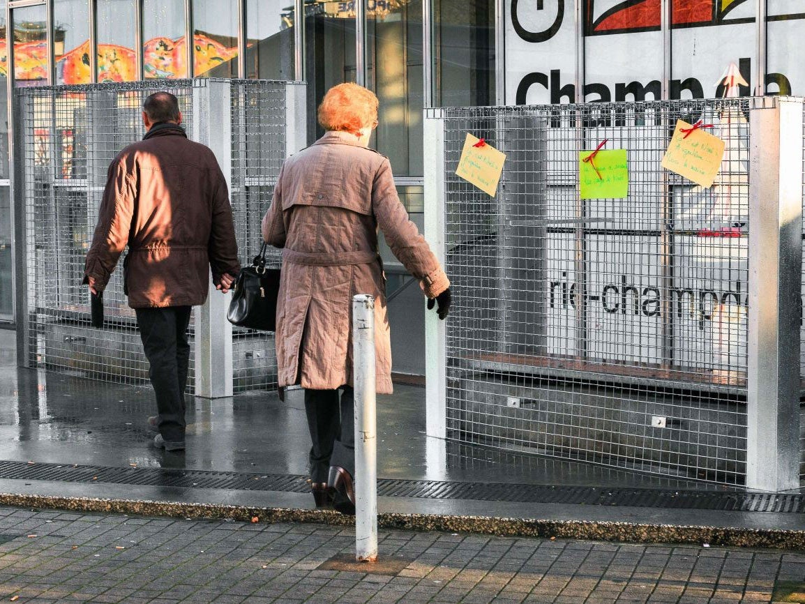 Cages surrounding each bench in a shopping precinct in Angouleme, south-west France, over Christmas