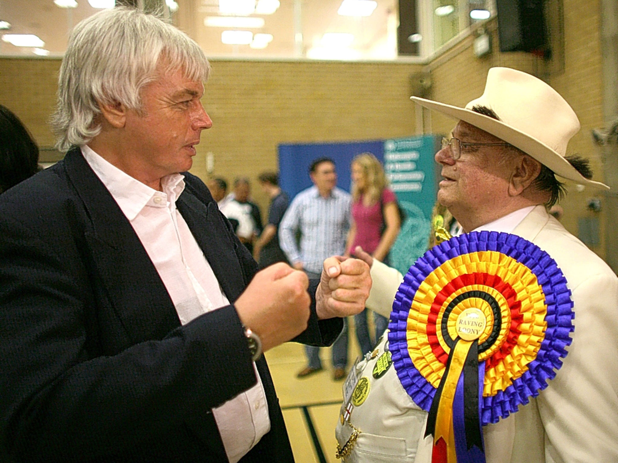 Former goalkeeper turned guru David Icke (left) greets a board member on his arrival at the FA