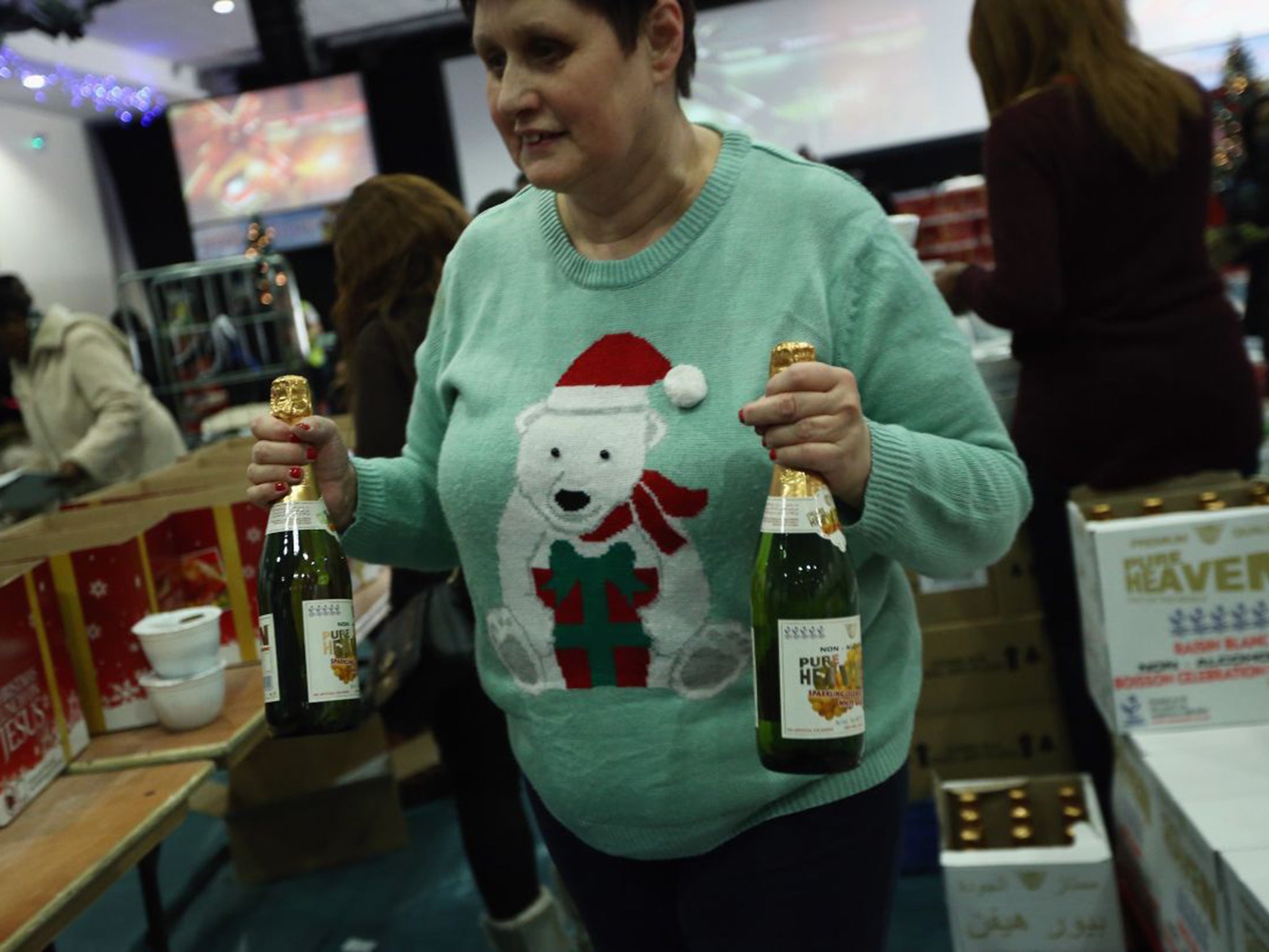 A member of the Jesus House Church helps package Christmas hampers as part of The Trussell Trust Foodbank Project