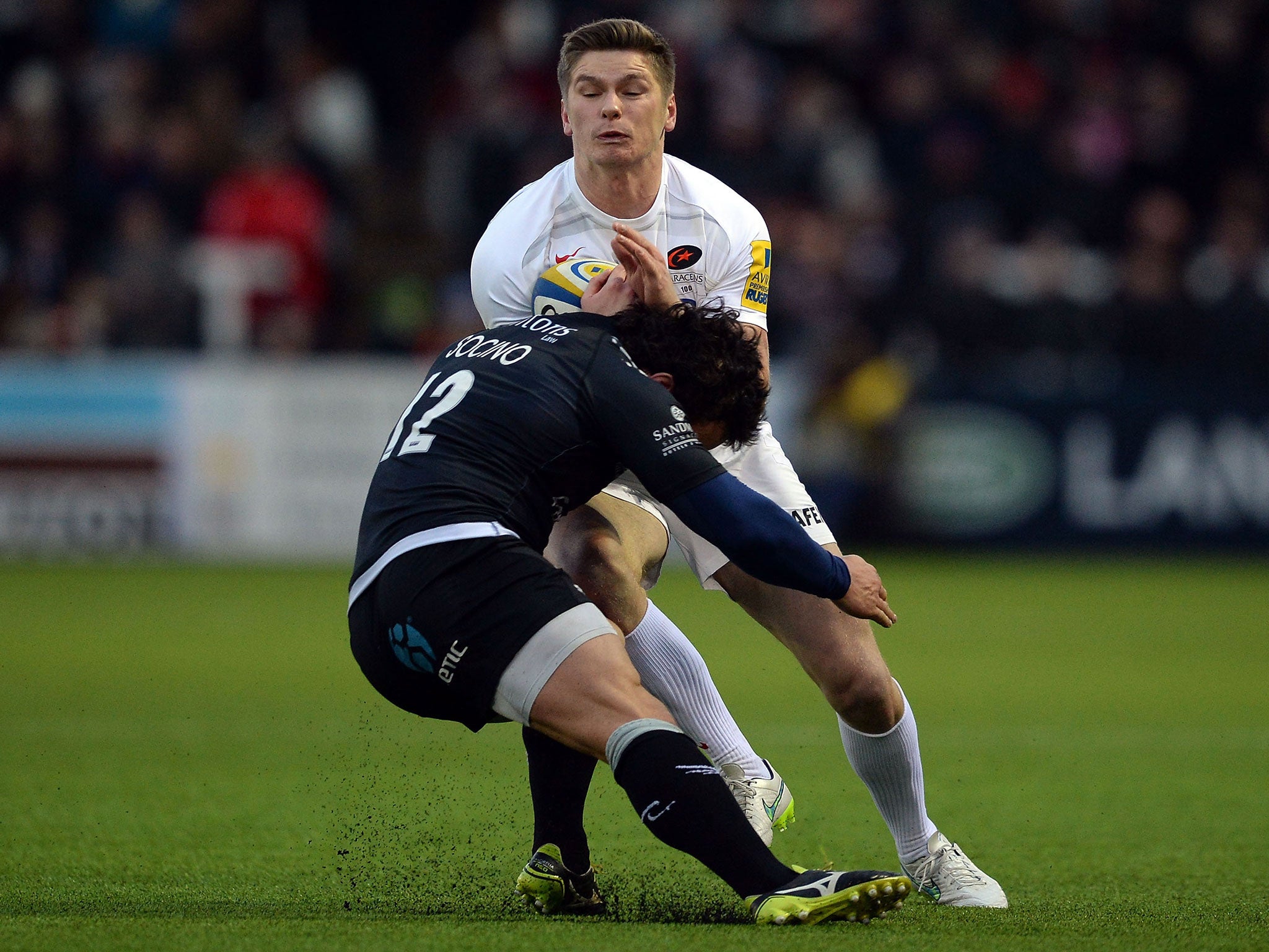 Juan Pablo Socino (L) of Newcastle Falcons tackles Owen Farrell of Saracens