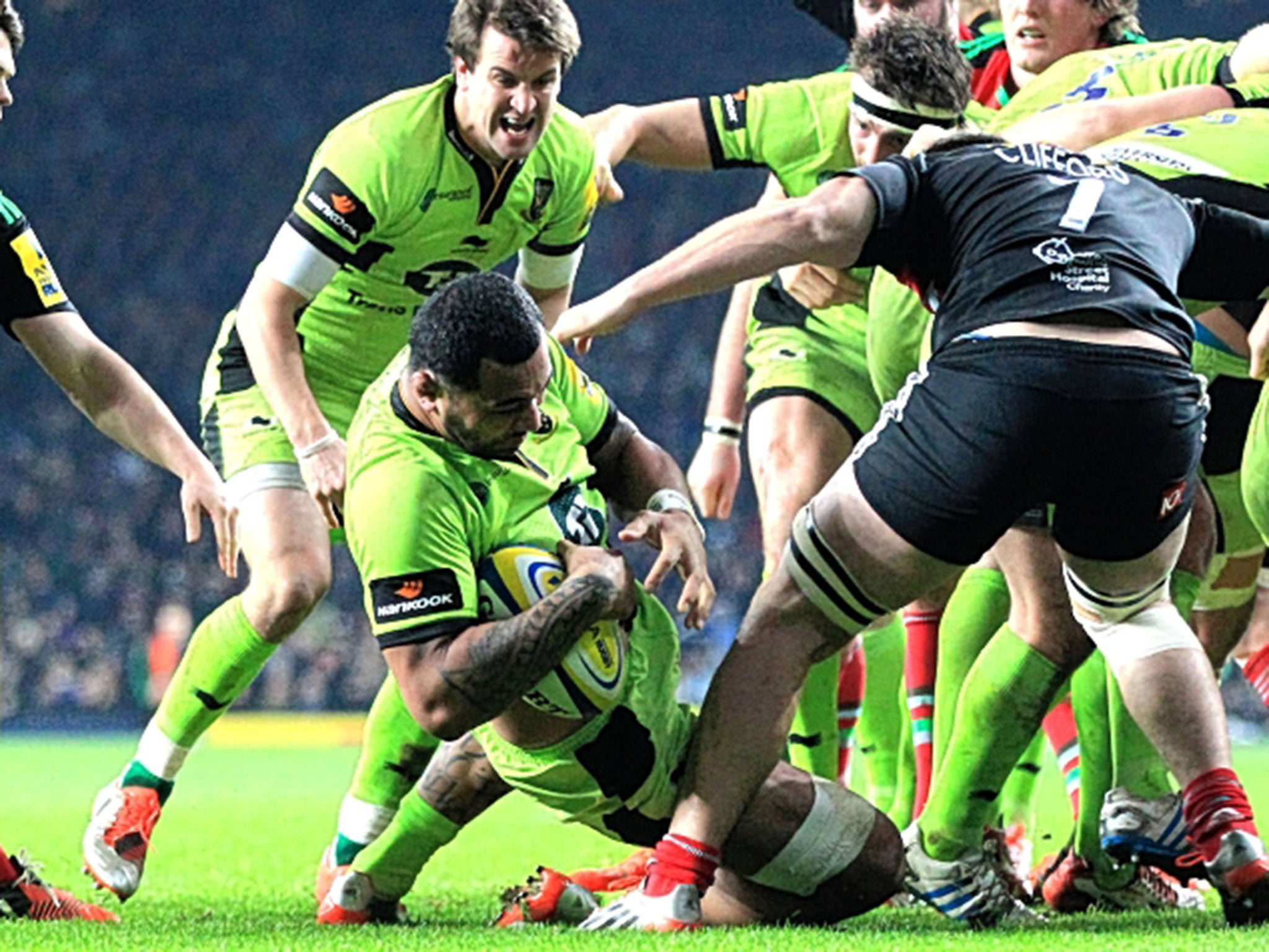 Taking a dive: Samu Manoa drops in to score Northampton’s first try