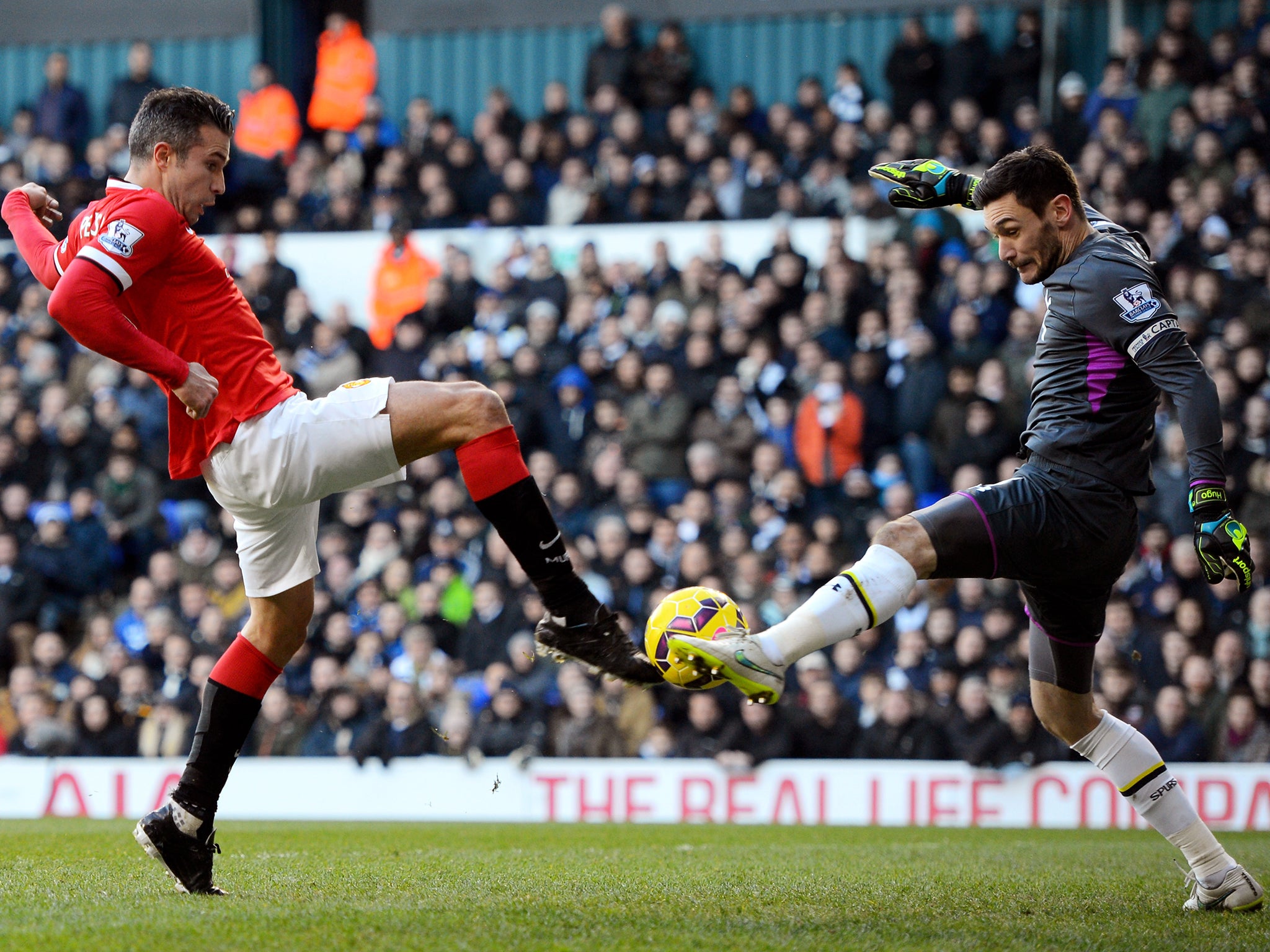 Robin van Persie is blocked by Hugo Lloris