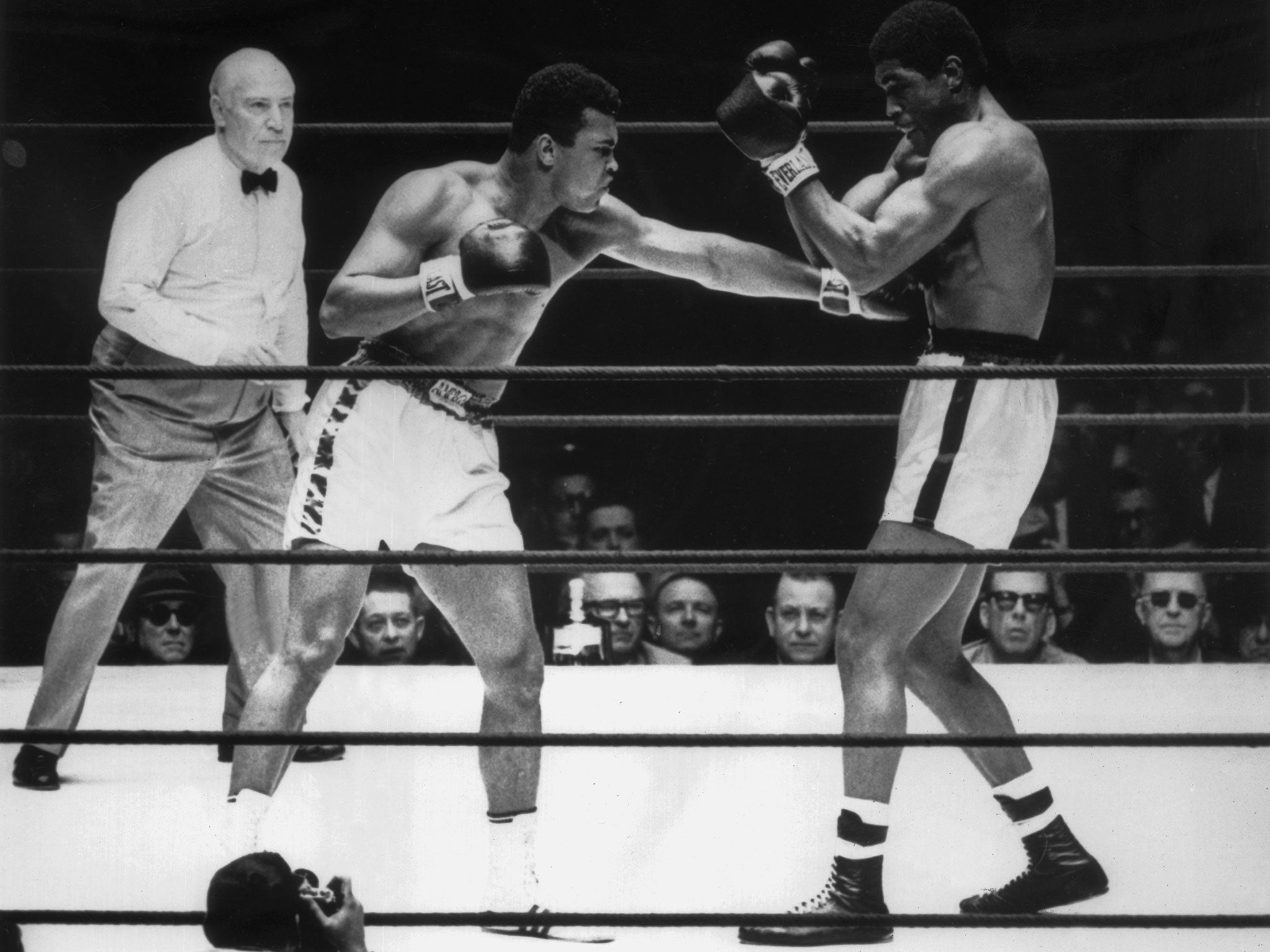 Muhammad Ali, left, pounds Terrell at the Houston Astrodome in 1967