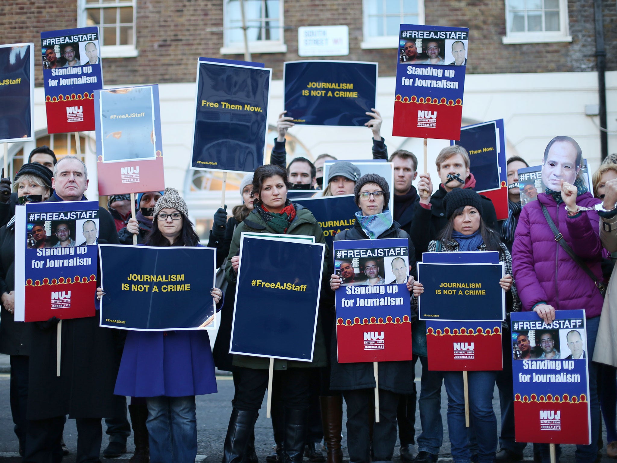 Journalists and supporters demonstrate outside the Egyptian embassy as they call for the release of fellow reporters in London