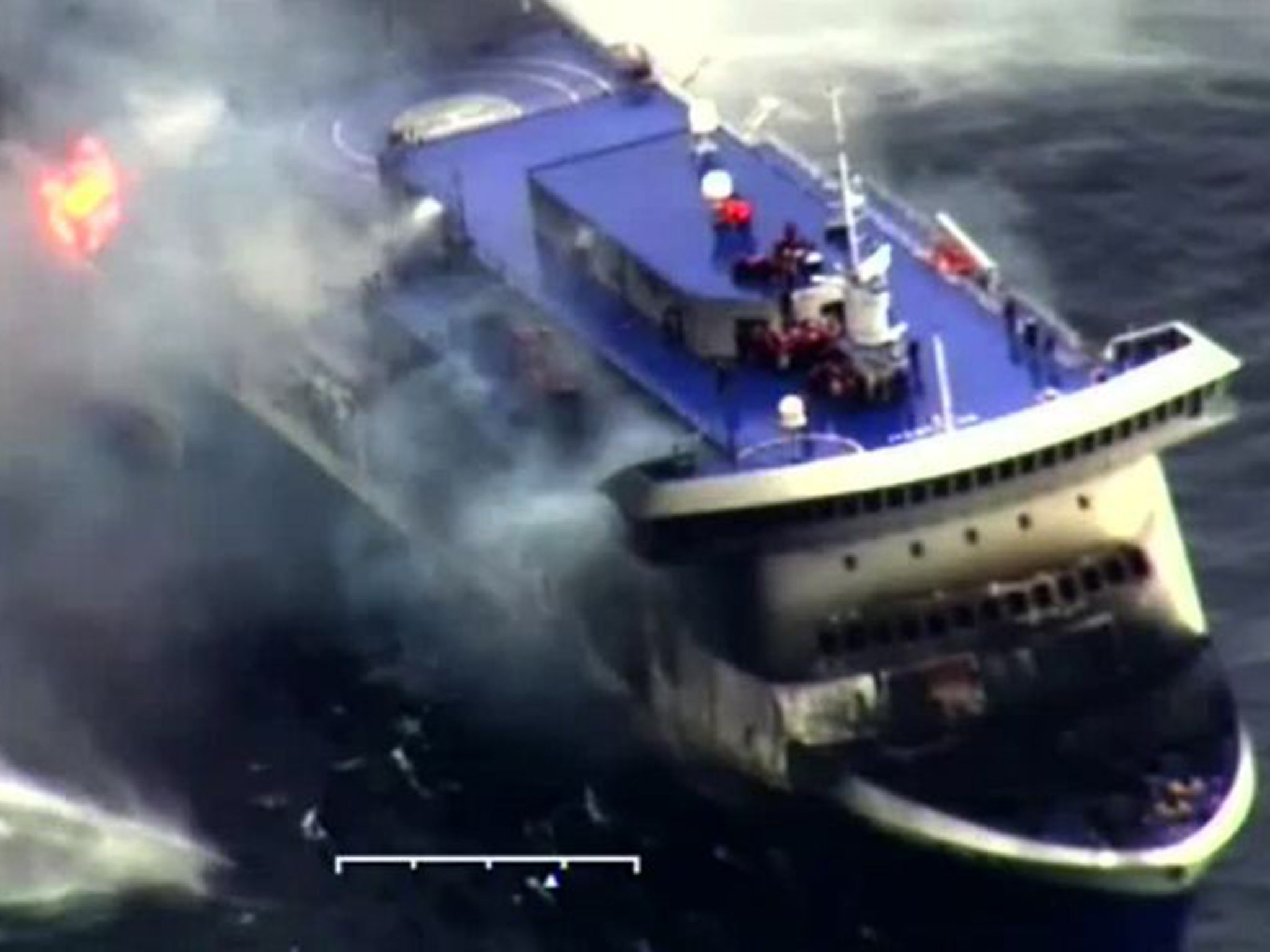 A video made available by the Italian coast guard shows flames licking around the edges of the ‘Norman Atlantic’ ferry