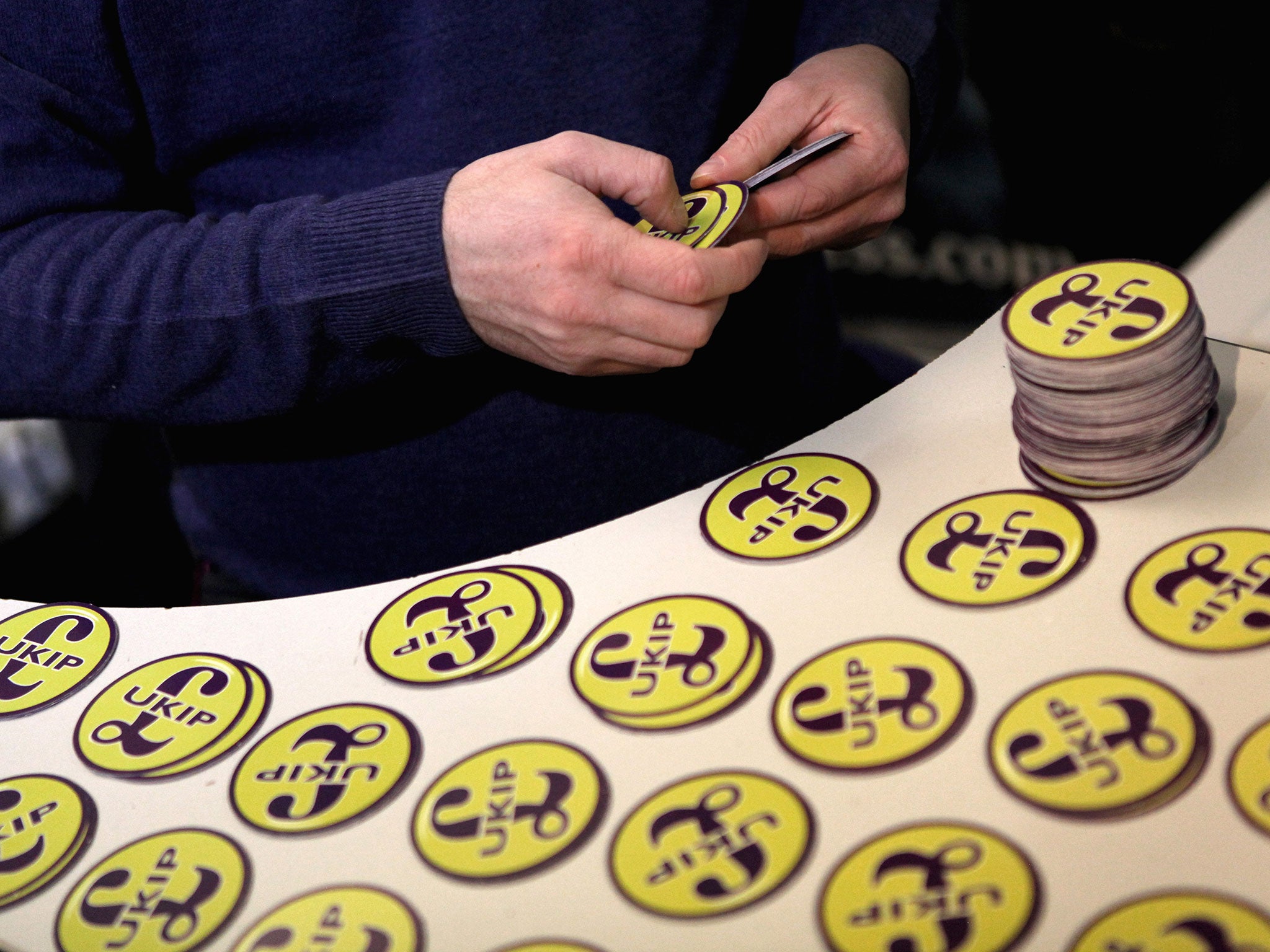 A United Kingdom Independence Party (UKIP) volunteer gets ready to send out car stickers