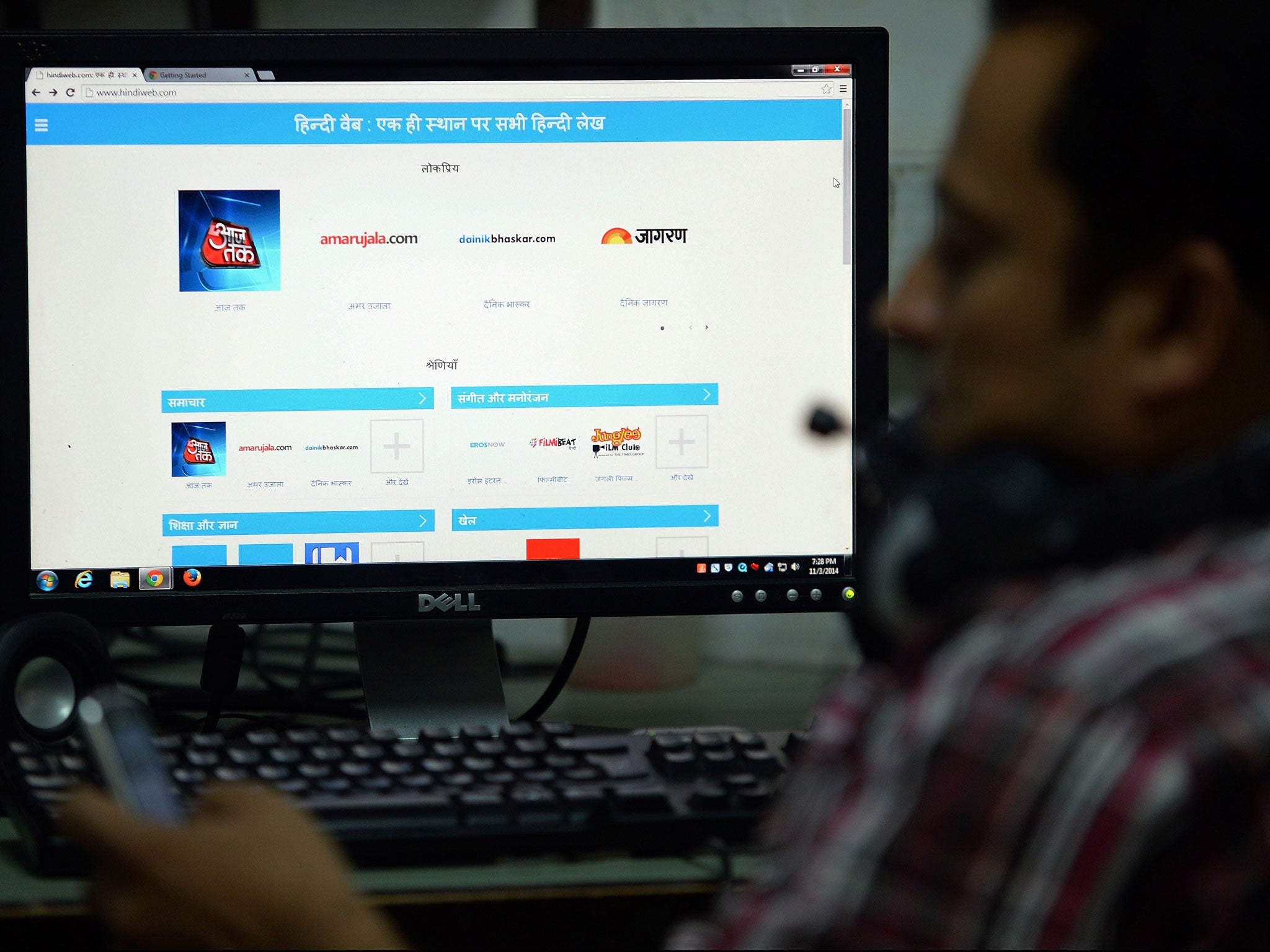 An Indian man browses the google-run hindiweb.com website in New Delhi on November 3, 2014