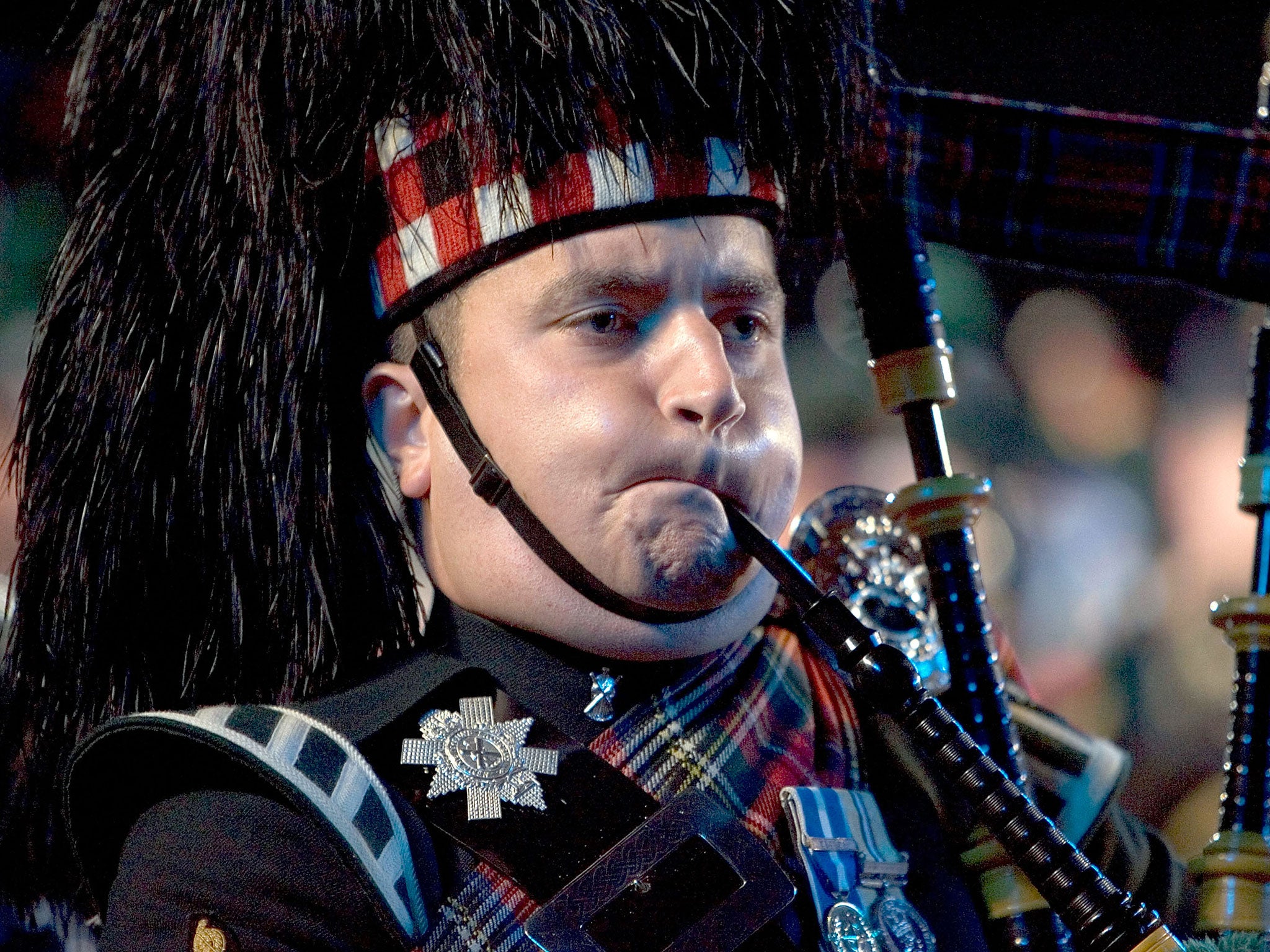 A bagpiper performs at the Edinburgh Military Tattoo