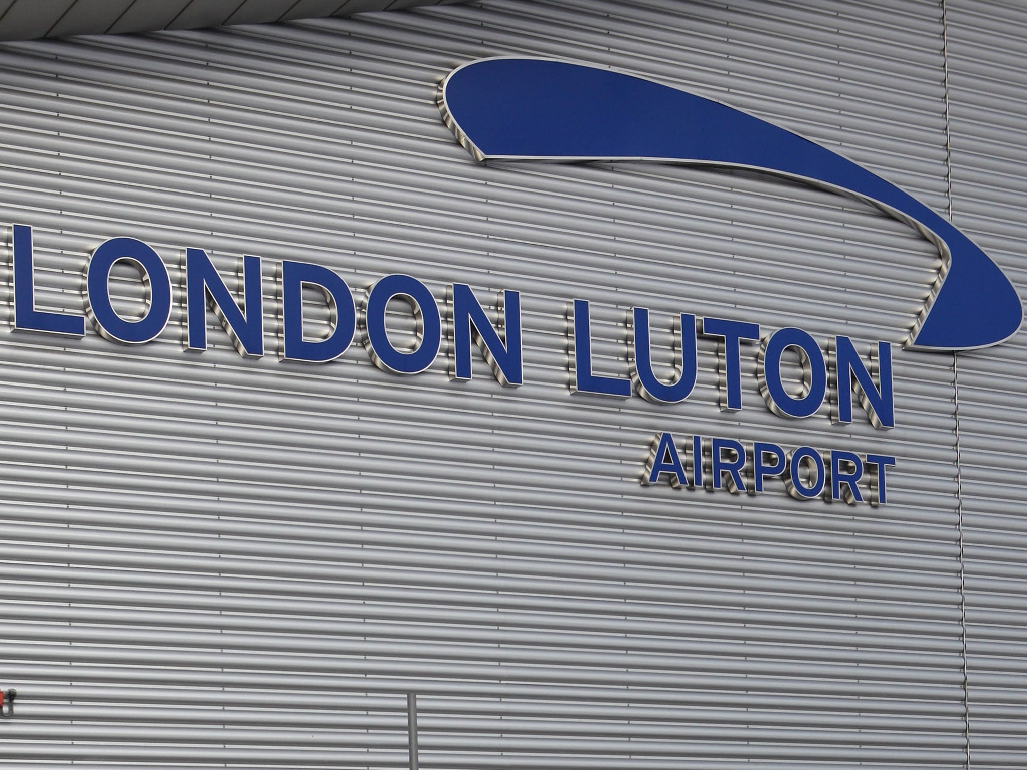 A woman has been arrested at Luton airport