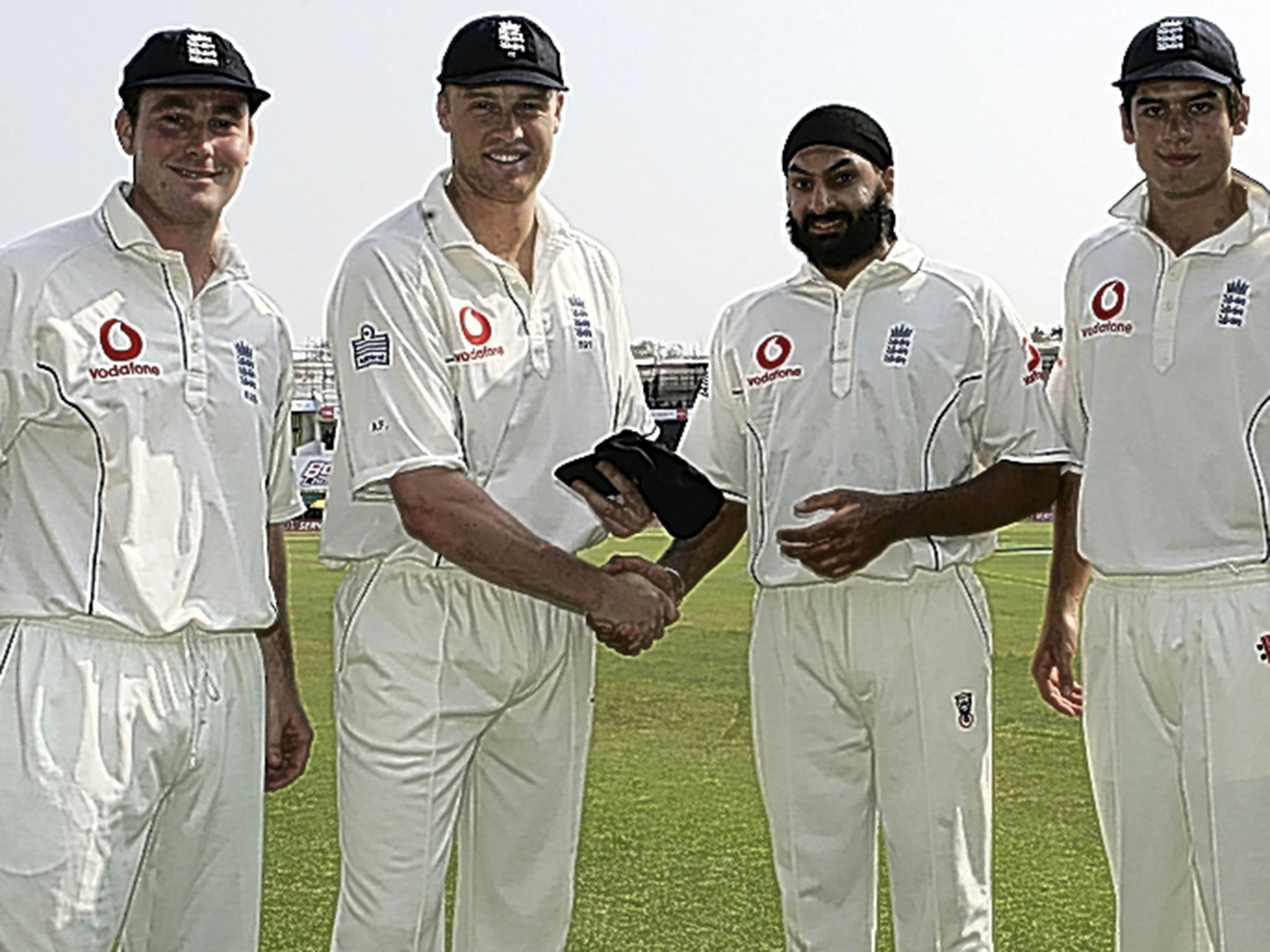 Andrew Flintoff, of England, (second from left) presents new caps to Ian Blackwell (left), Monty Panesar and Alastair Cook before the first day of the first Test against India on 1 March, 2006