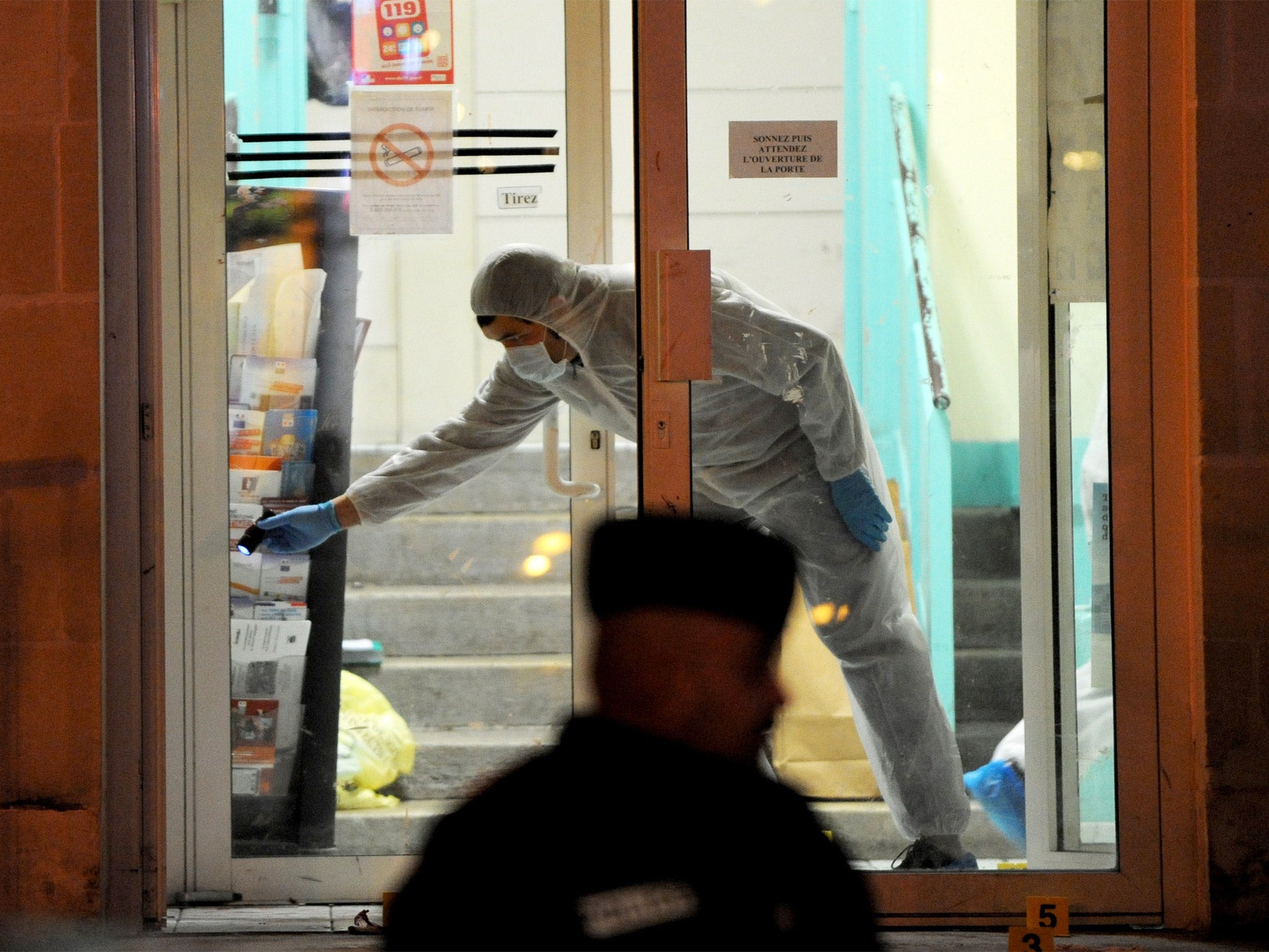 Evidence is collected outside the police station of Joue les-Tours, where officers shot dead a man who attacked them with a knife