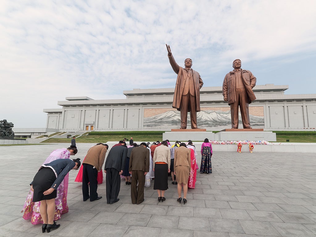 North Koreans pay homage before statues of former Presidents Kim Il Sung and Kim Jong Il, Mansudae Assembly Hall on Mansu Hill, Pyongyang