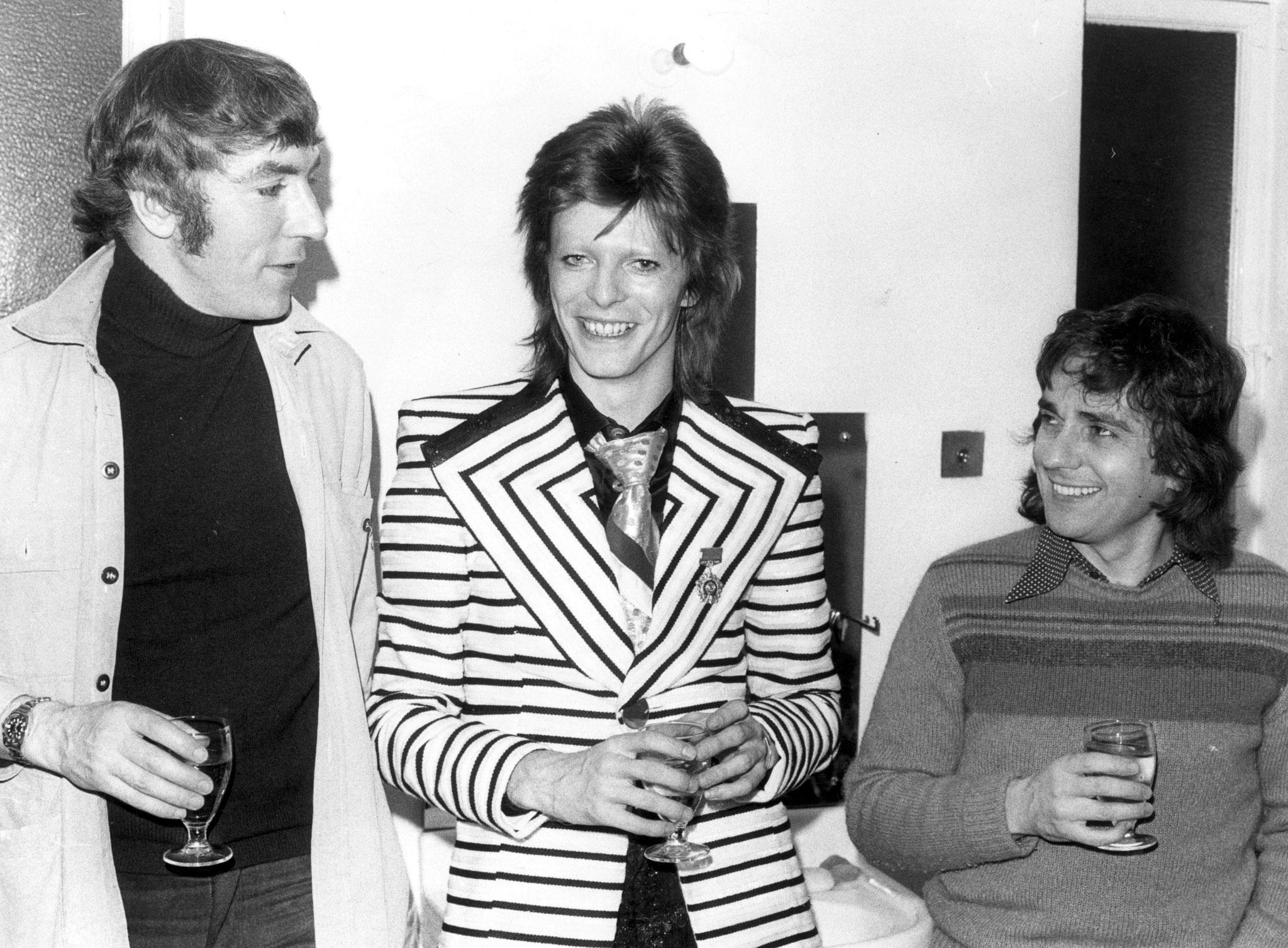 Cook and Dudley Moore with David Bowie (centre) backstage at the Cambridge Theatre in London in 1973 (Getty Images)