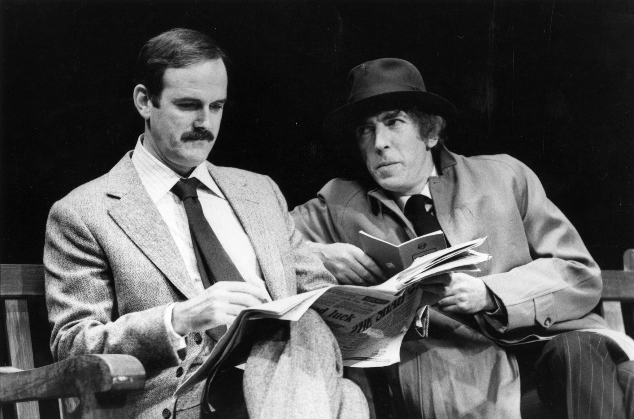 John Cleese (left) and Peter Cook during The Secret Policeman's Ball in aid of Amnesty International in 1979 (Getty Images)