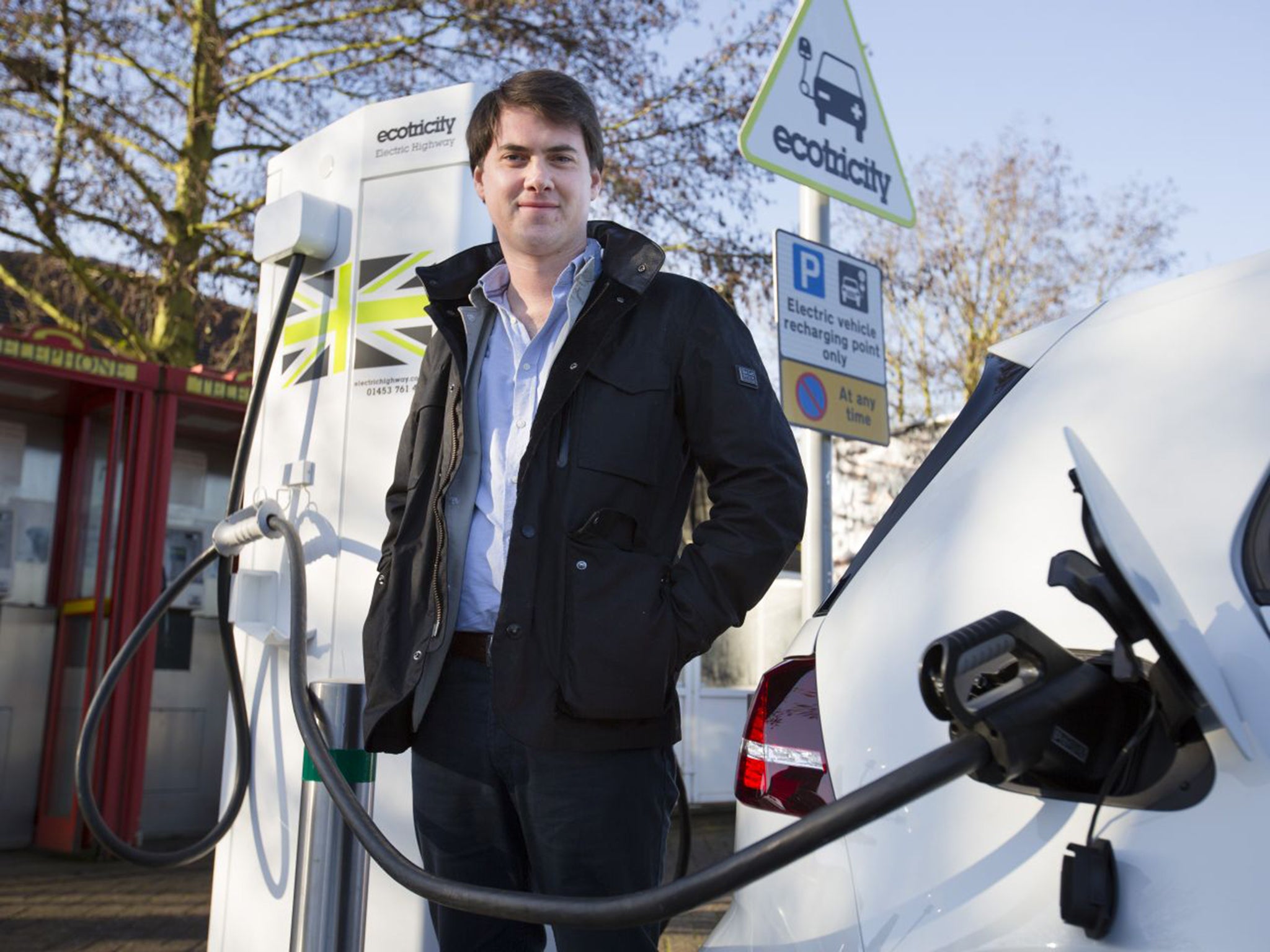 Jamie Merrill recharging a VW e-Golf at Warwick services on the M40 before setting off to Wigan (Andrew Fox)