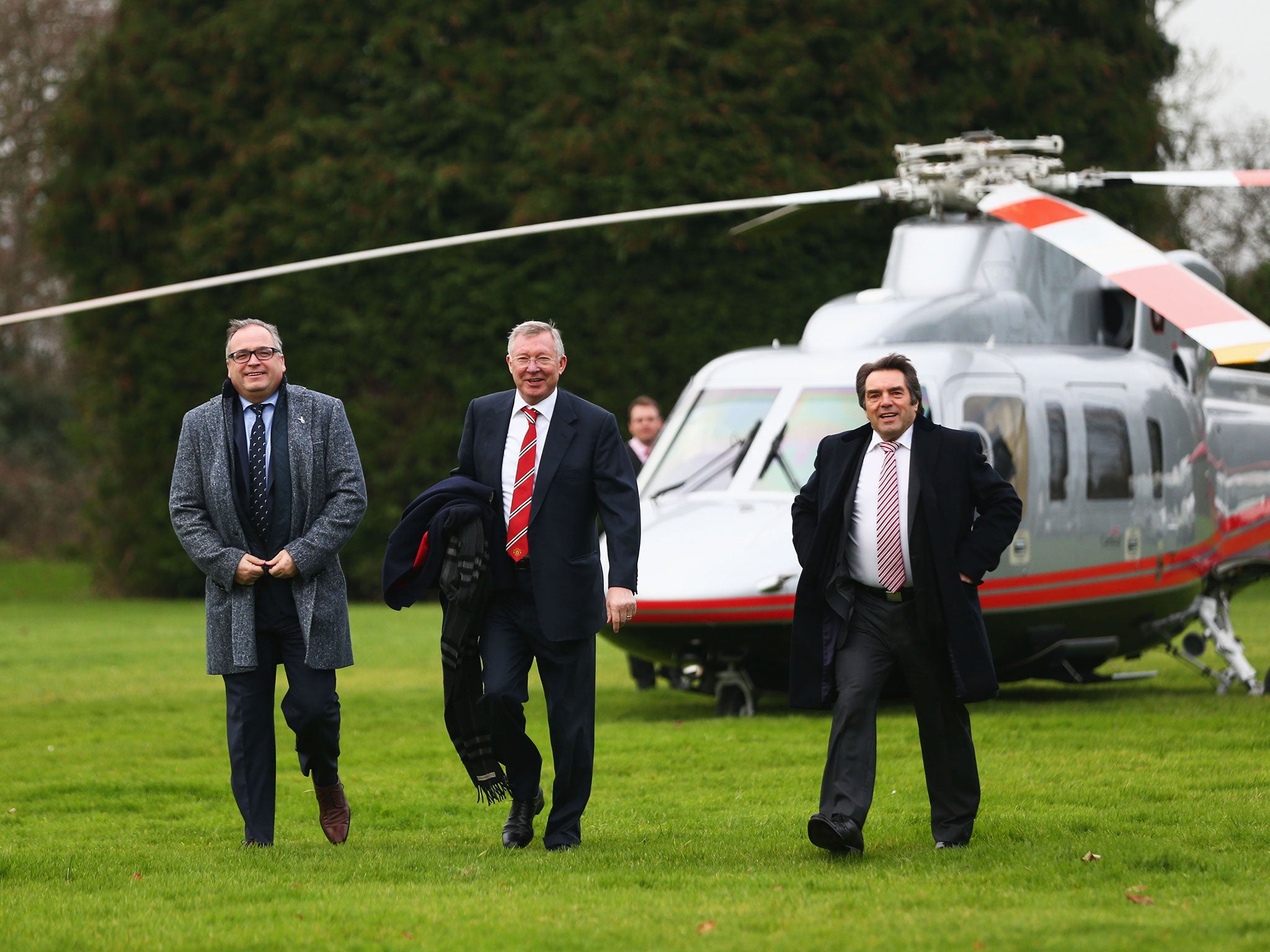 Ferguson (centre) leaves the chopper on his way to Huish Park