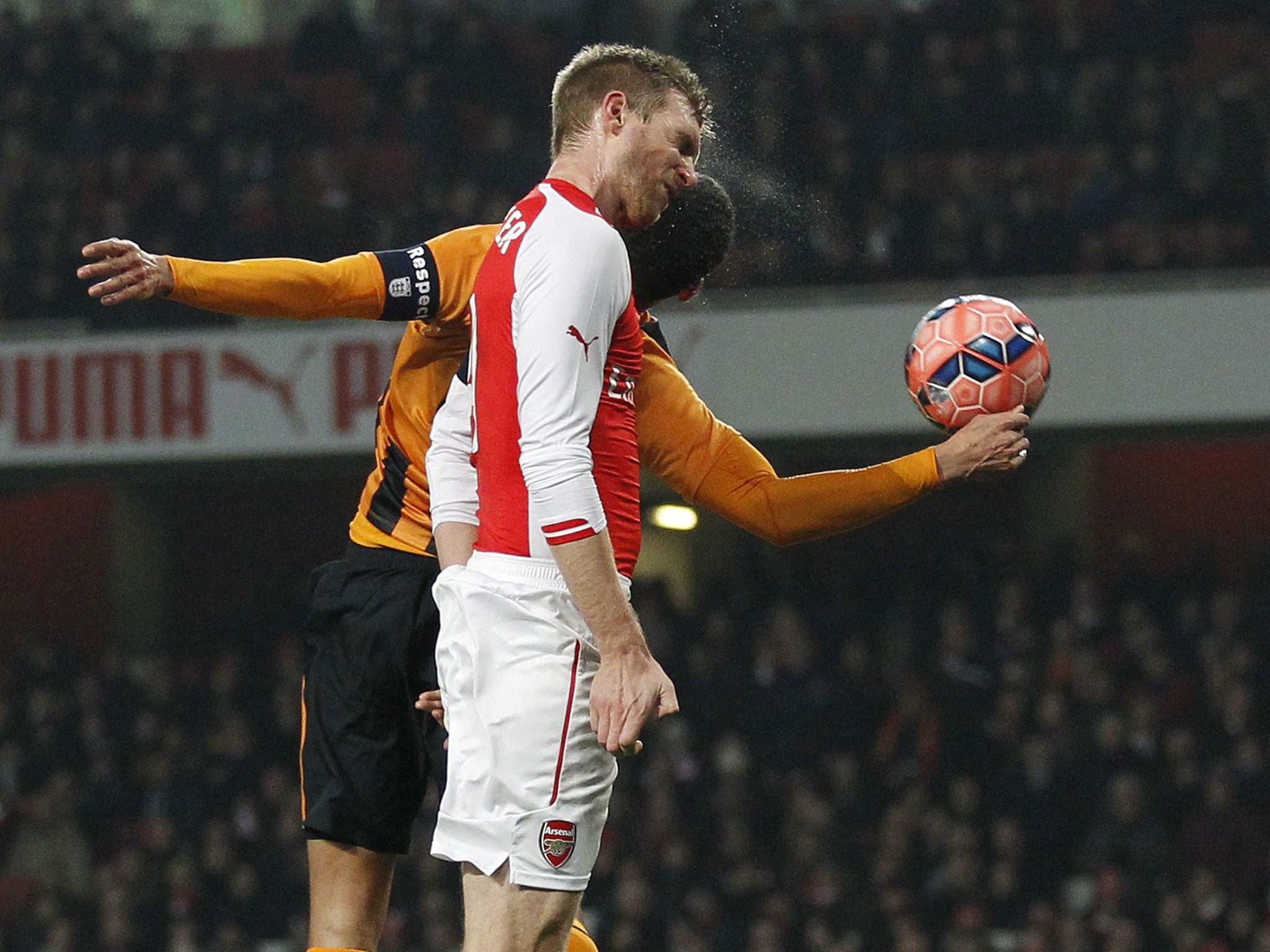 Per Mertesacker heads Arsenal in front against Hull