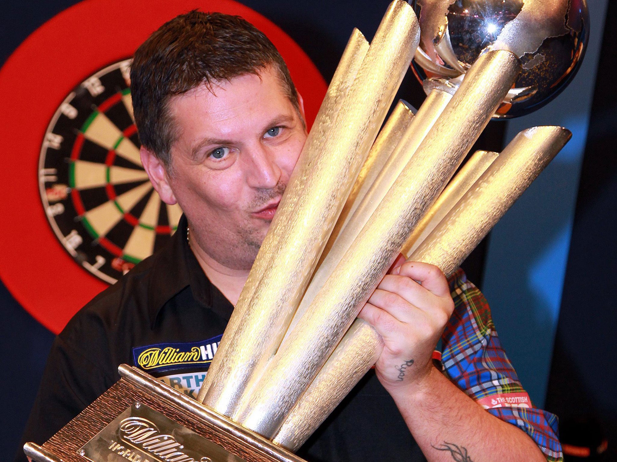 Scotland's Gary Anderson celebrates his win during the PDC World darts final against Phil Taylor of England at the Alexandra Palace in London, England