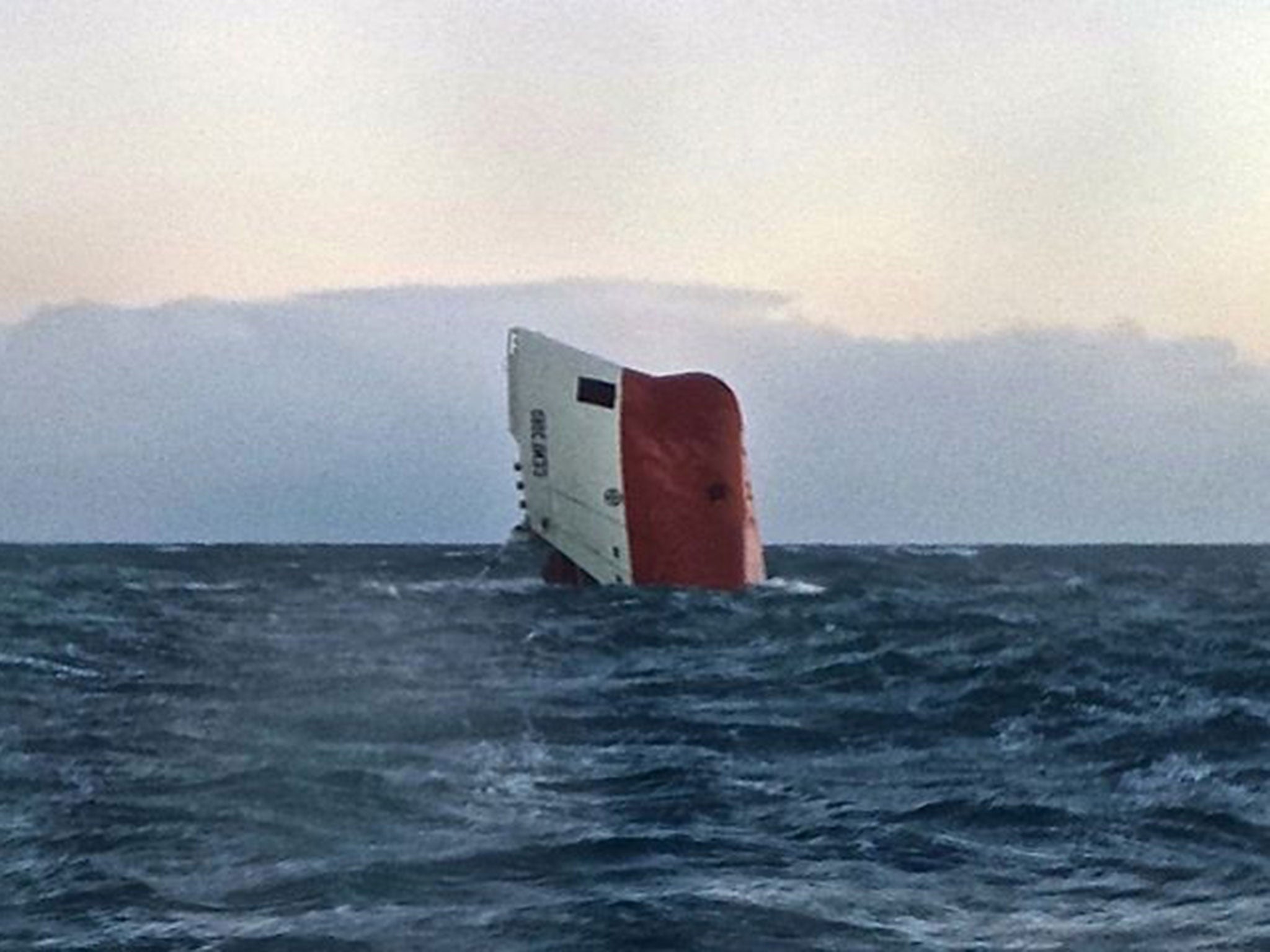 The upturned hull of the Cypriot-registered cargo vessel Cemfjord in the sea 15 miles from Wick