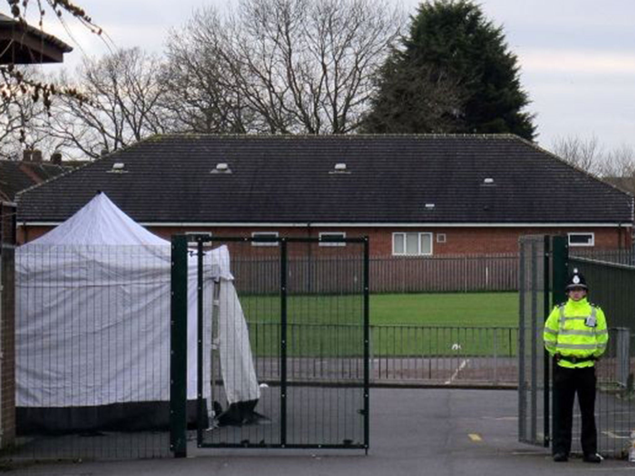 Police outside Harlescott Junior School in Shrewsbury after a woman was found dead