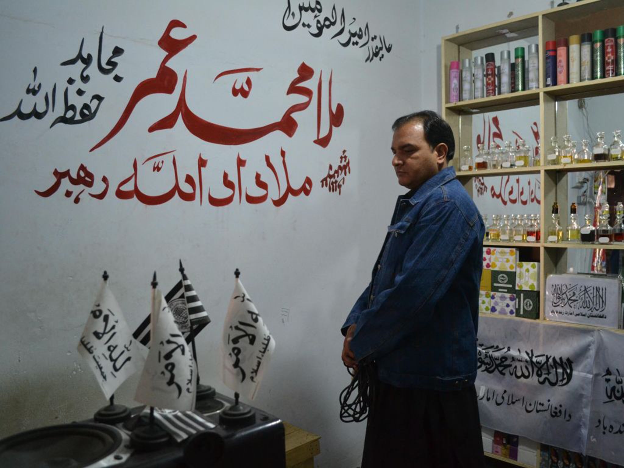 The name of the Afghan Taliban leader, Mullah Mohammad Omar, written on a shop wall in Quetta shortly before the premises were sealed by police