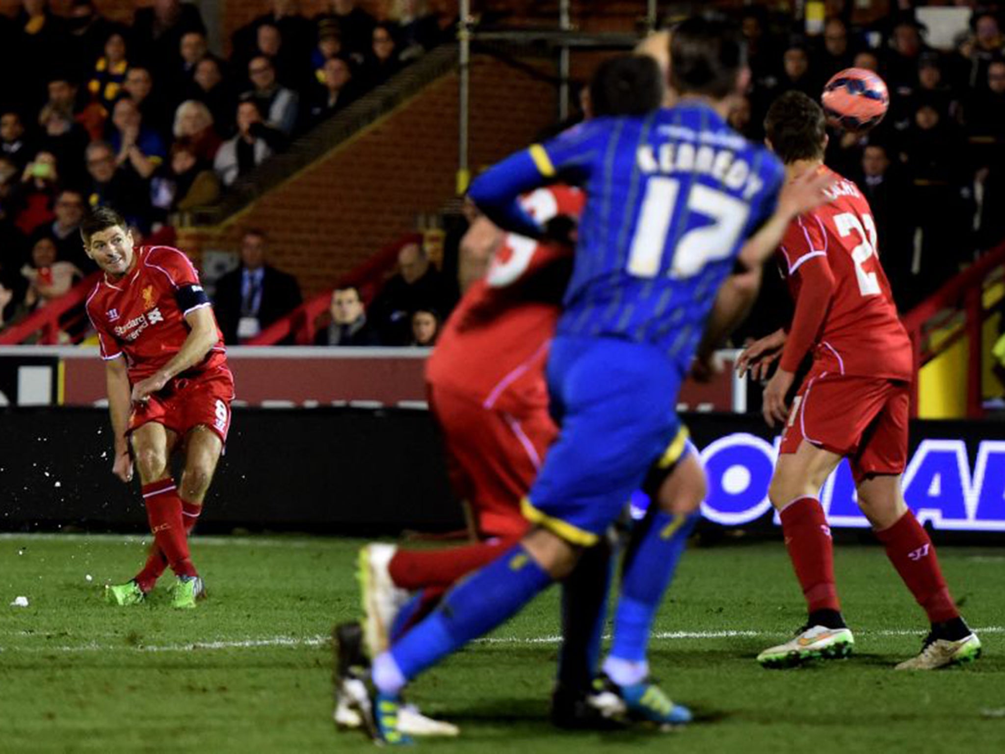 Steven Gerrard curls in his – and Liverpool’s – second goal in last night’s FA Cup tie at AFC Wimbledon