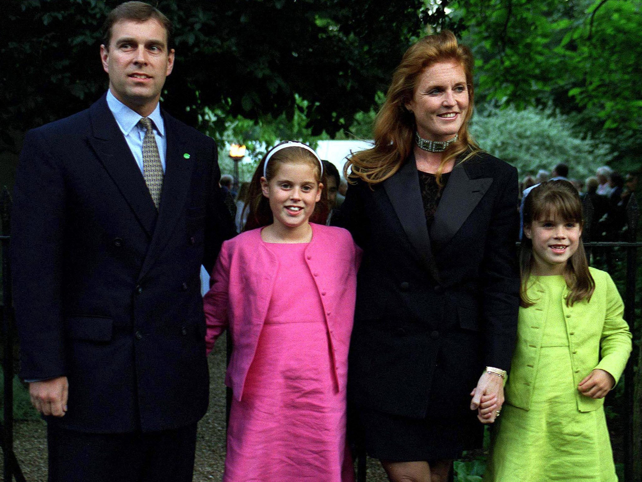 Prince Andrew and Sarah Ferguson with Princess Beatrice and Eugenie at a party for Sir David Frost in 1999