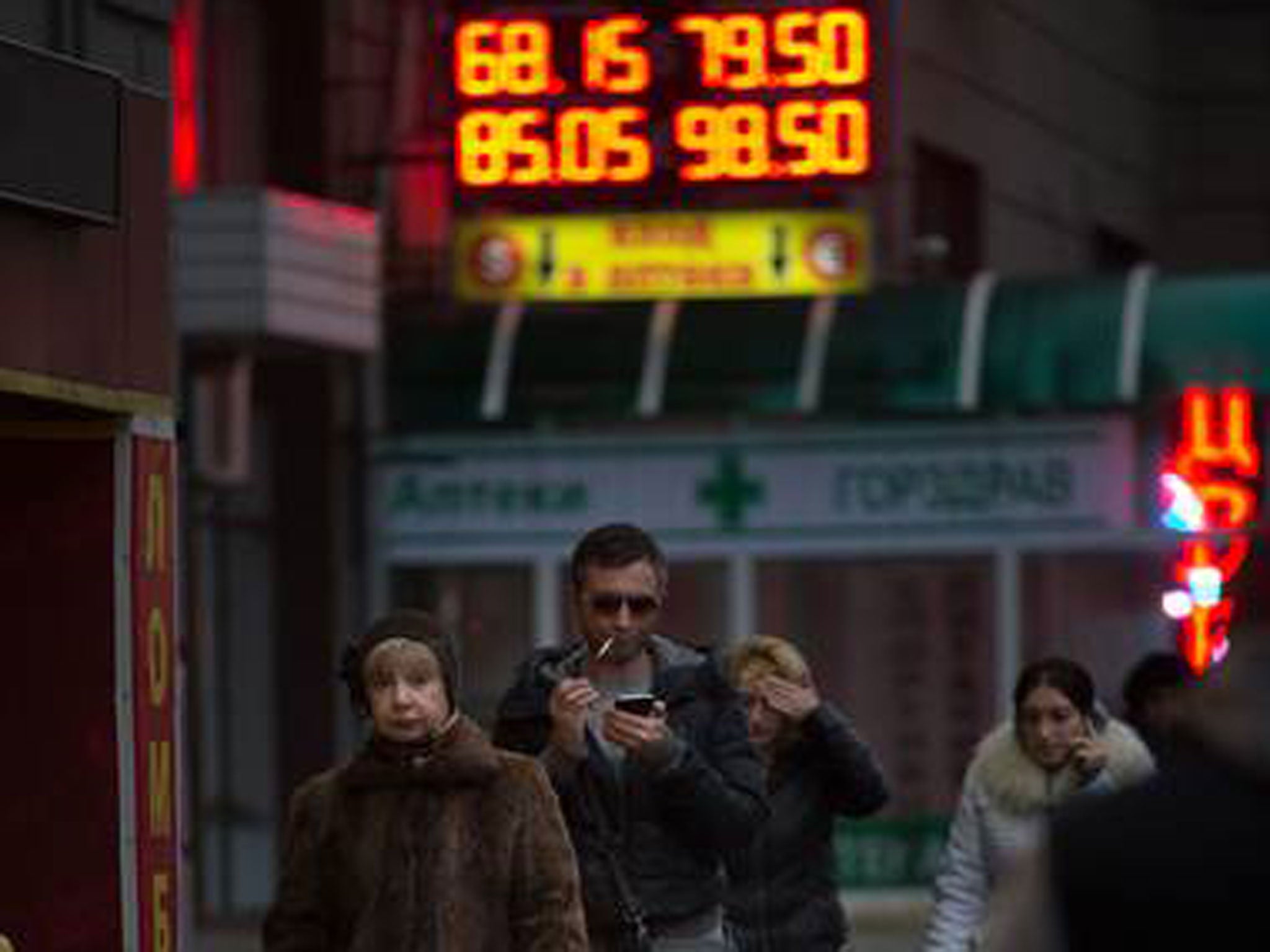 Currency rates on display at an exchange office in Moscow