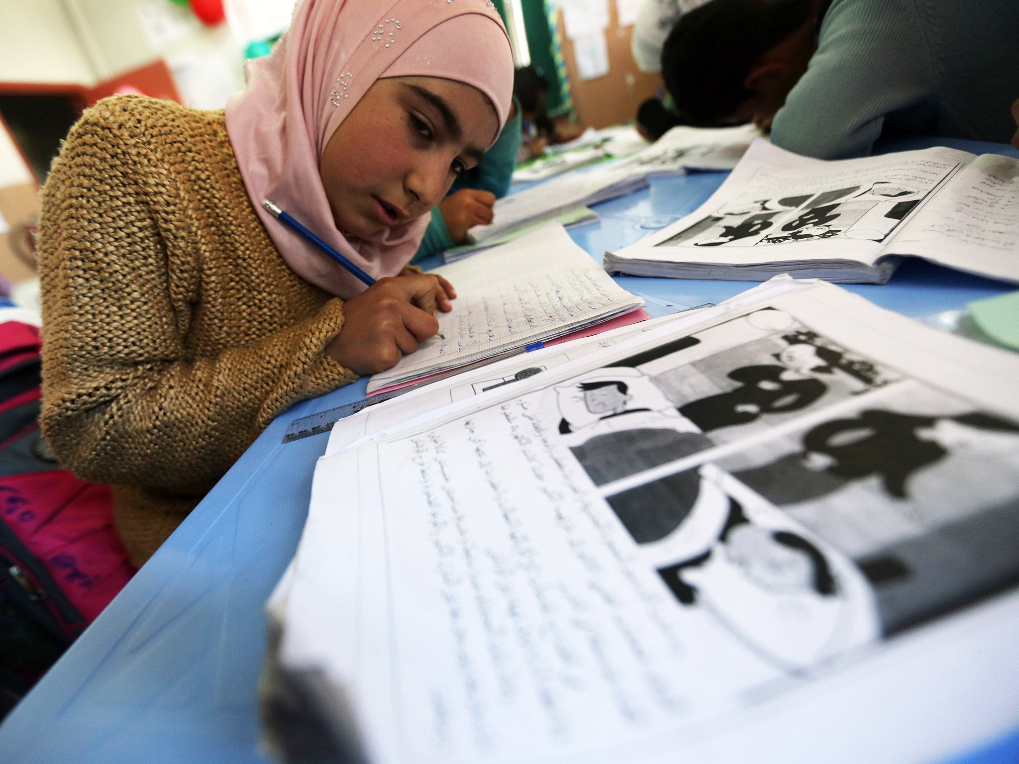 A class at a school for Syrian refugees in the Lebanese village of Qaraoun, in the west of the Bekaa Valley(Getty)