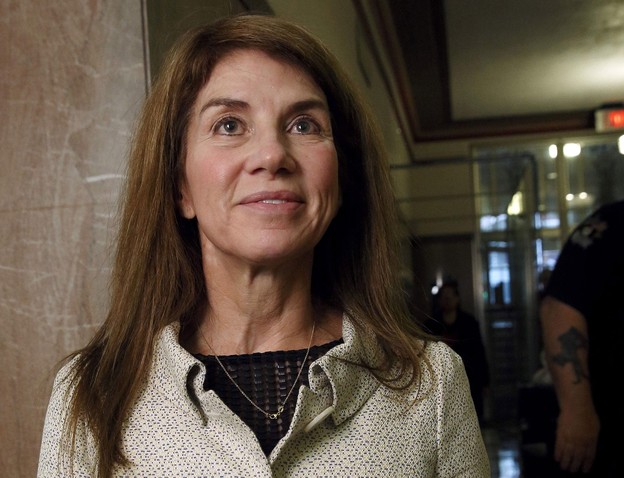 Sue Ann Arnall stands in the courthouse hall before divorce proceedings with Harold Hamm, founder and CEO of Continental Resources (Reuters)