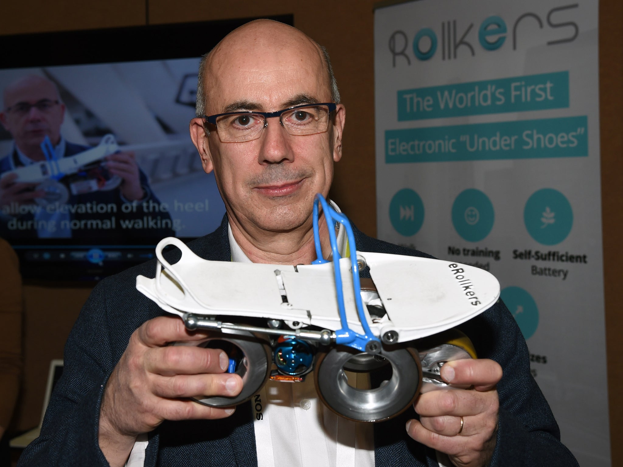 Paul Chavand displays the prototype Rollkers transportation device he invented during a press event